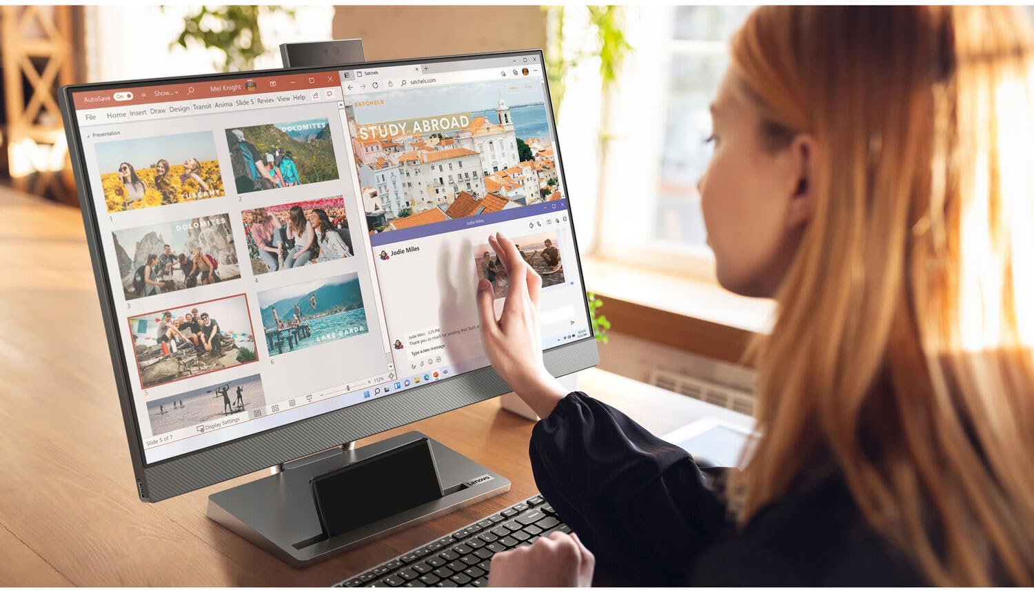User interacting with the touchscreen of the Lenovo AIO Desktop