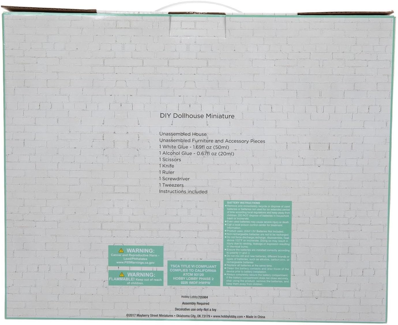 Back of the 'Summer by The Sea' kit box, showing a list of included tools and components, along with safety warnings.