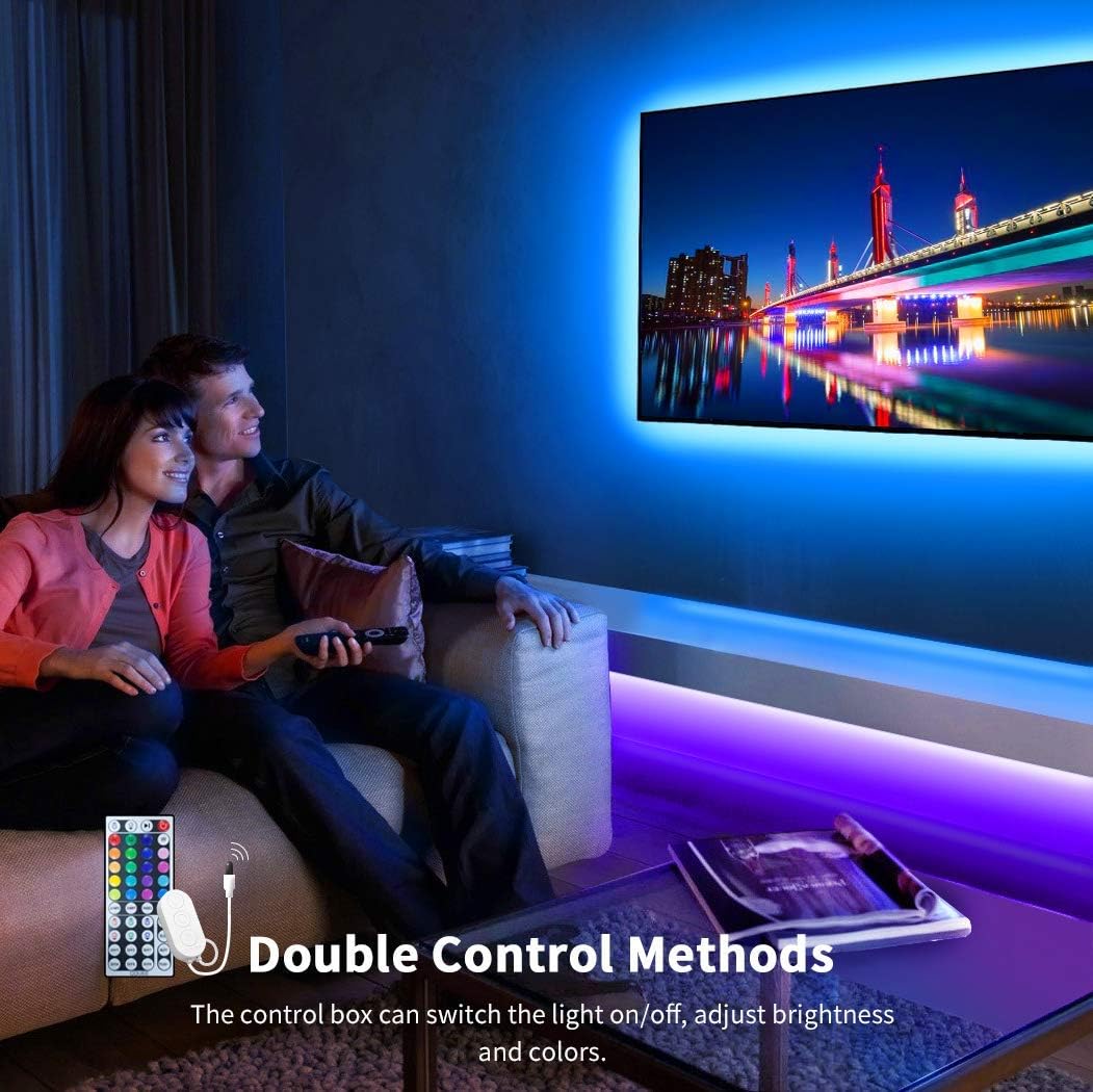 Couple watching TV with Govee LED strip lights providing backlighting.
