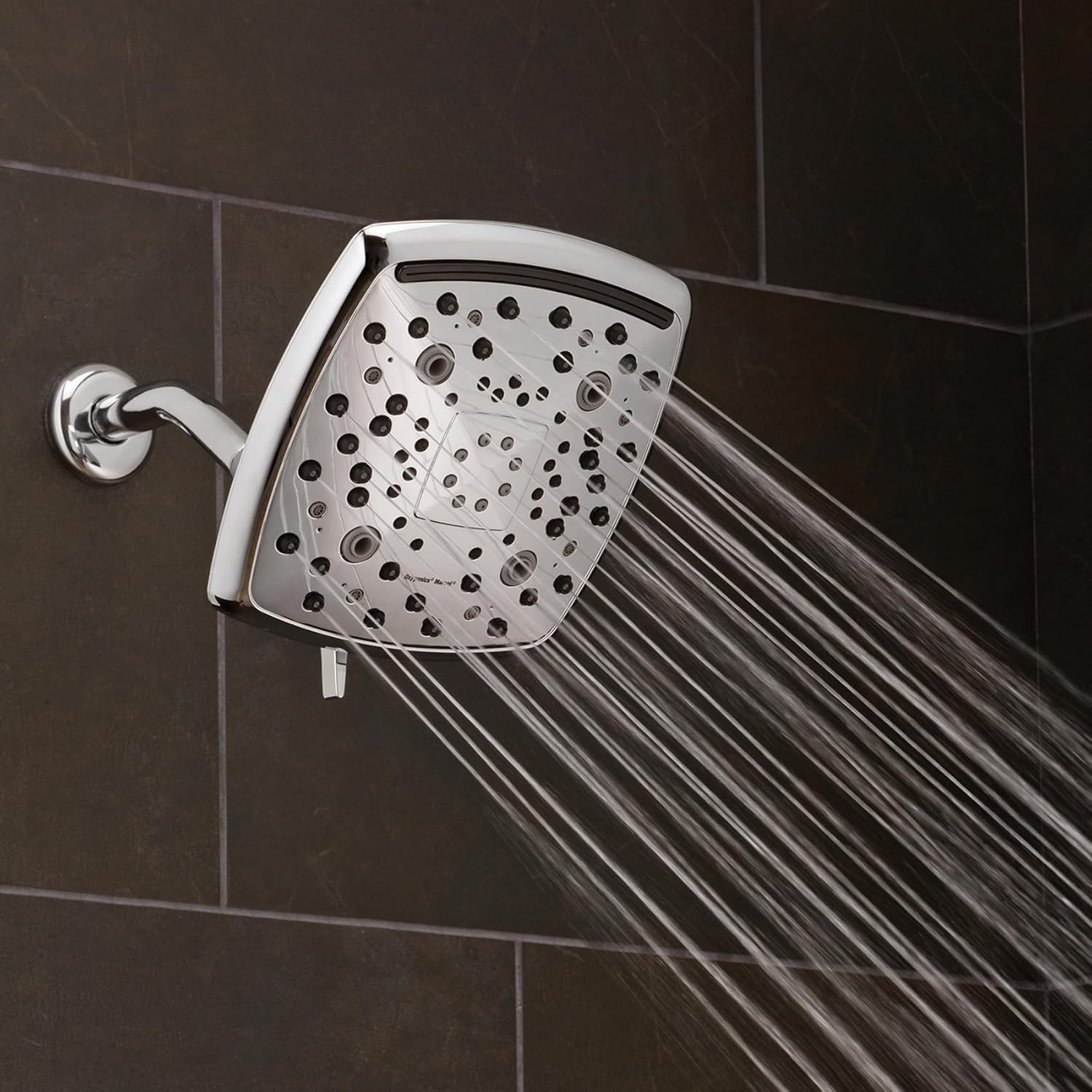Oxygenics Marvel Chrome Rain Shower Head with water spraying in a concentrated pattern