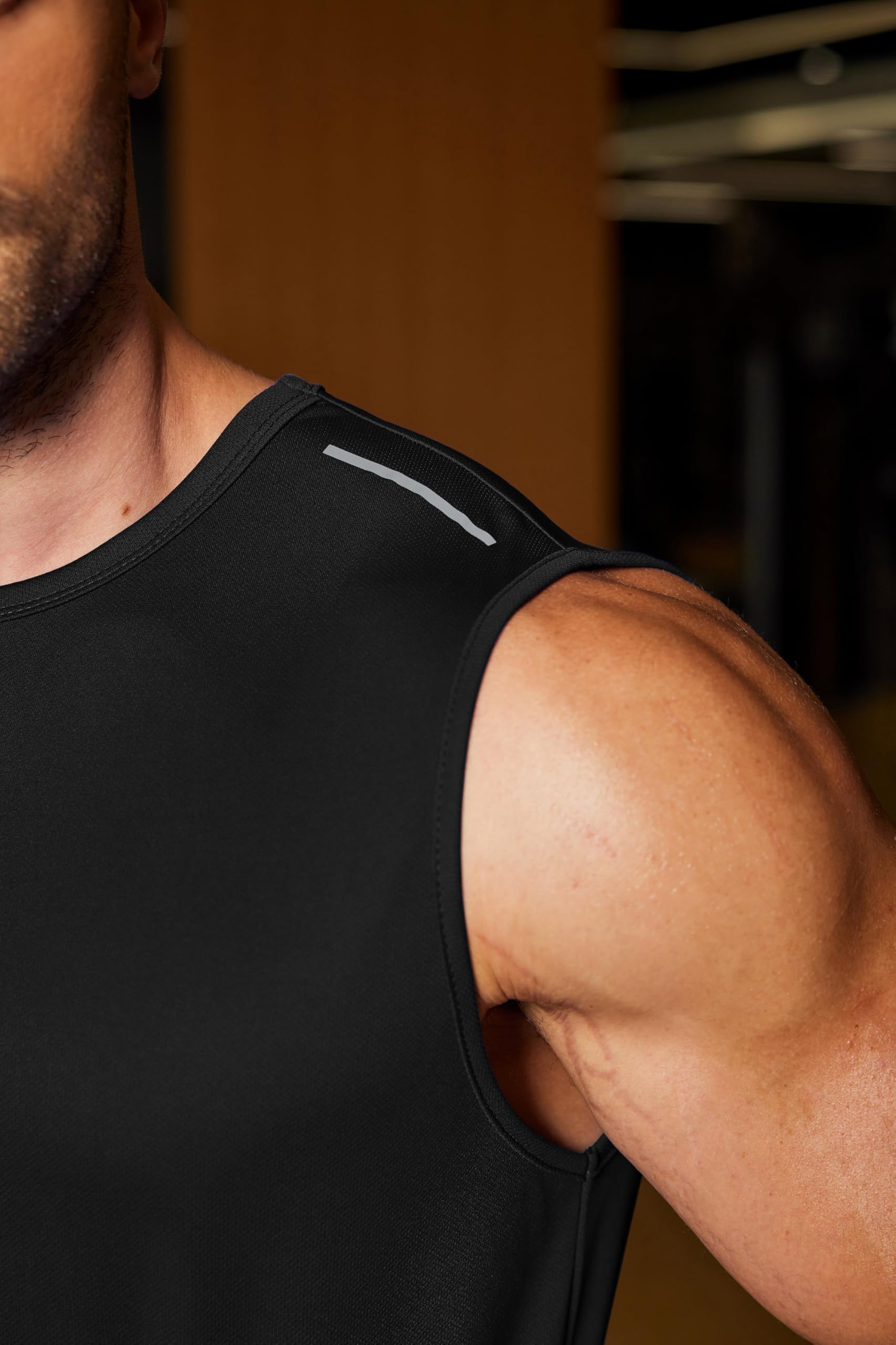 Close-up of the COOFANDY men's sleeveless workout tank top showing fabric texture.