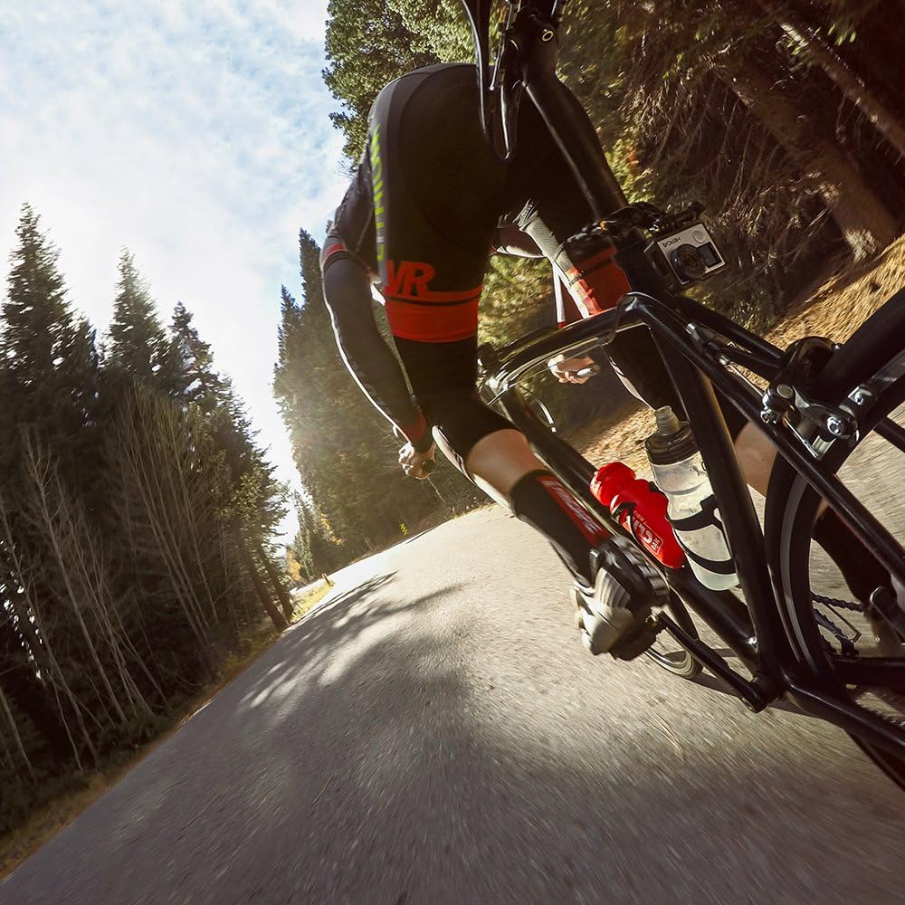 GoPro camera mounted on a bicycle frame, capturing a side view of a cyclist on a road.