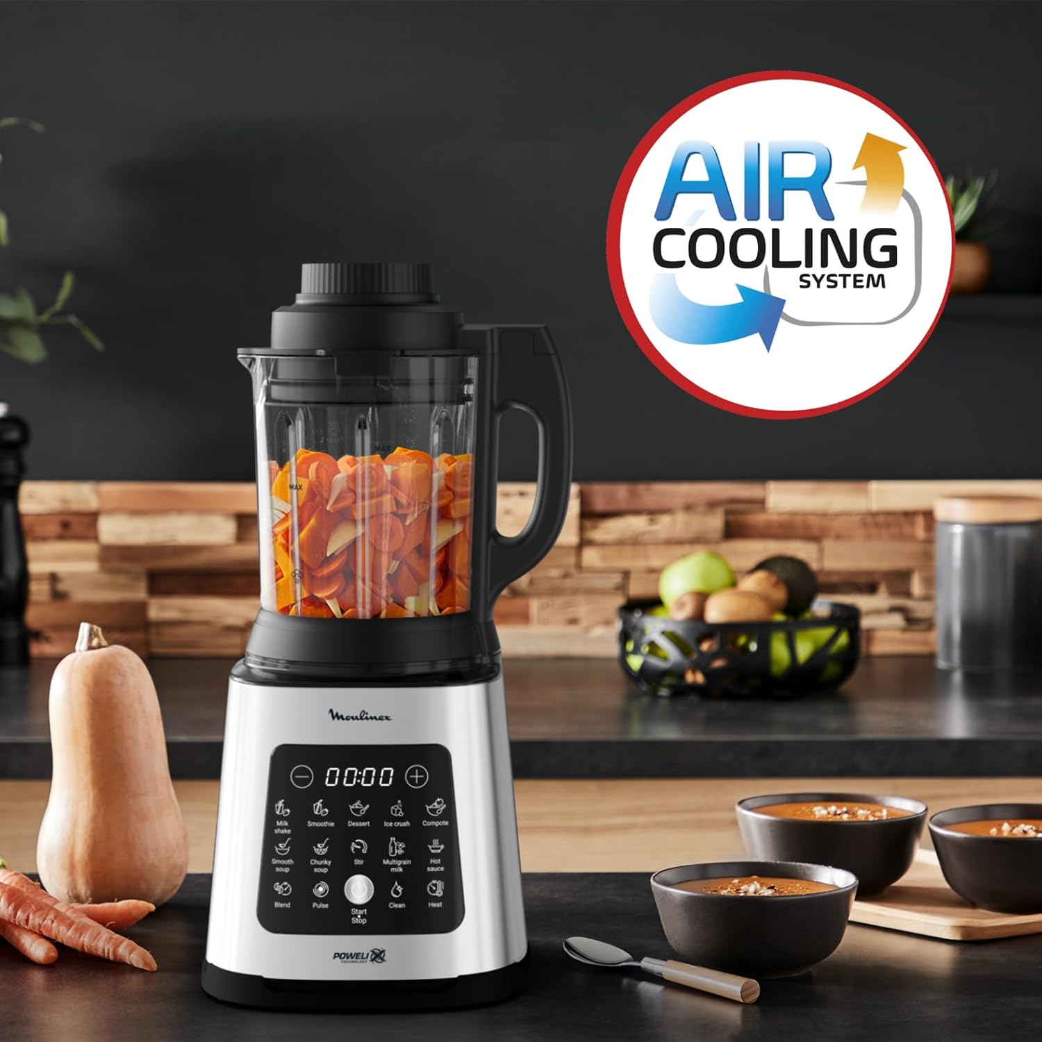 Hand cleaning the removable blade assembly of the Moulinex Perfect Mix Cook Blender under running water