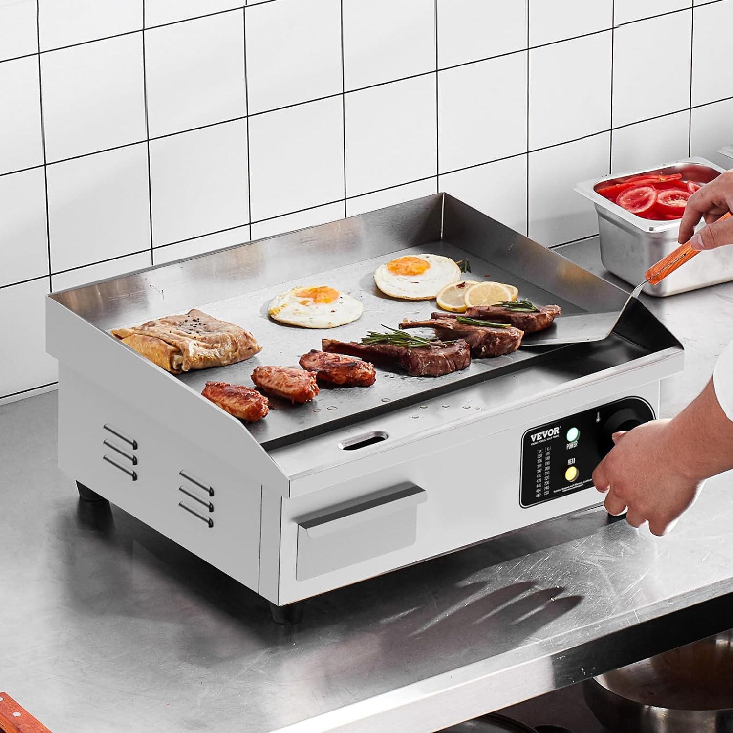 VEVOR Electric Griddle in use, cooking eggs, steaks, and sausages on a countertop.