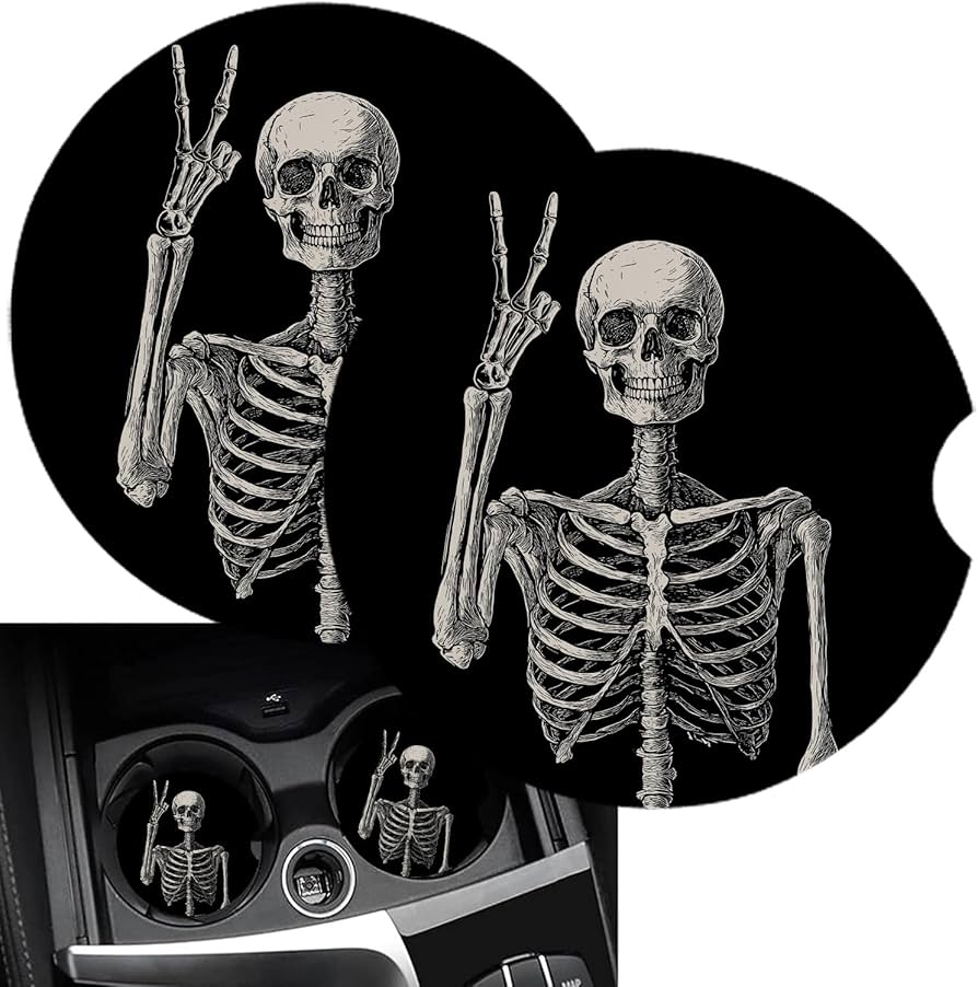 Stack of patterned porous stone coasters next to a glass of iced tea