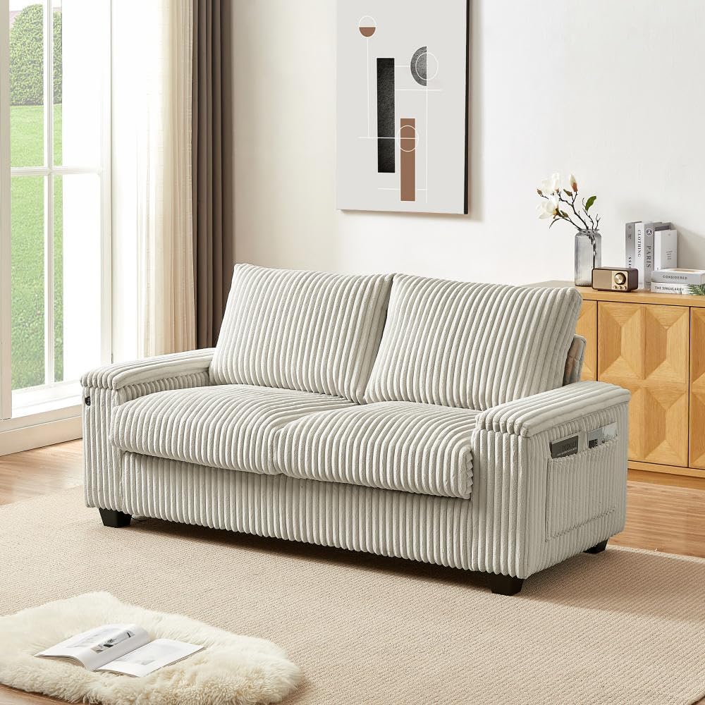 A smartphone connected to the built-in USB charging port on the side of the loveseat's armrest, showing it is actively charging.