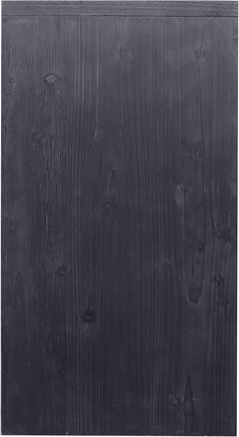 Close-up of the distressed black wood texture on the cabinet door