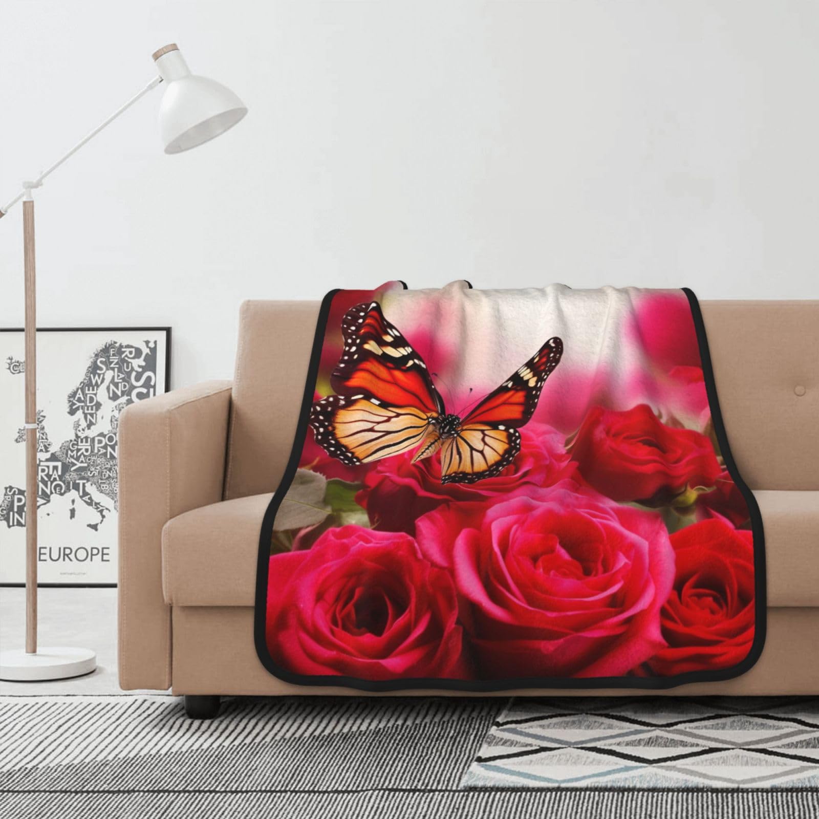 Jeté de canapé en flanelle motif roses pour soirée cocooning