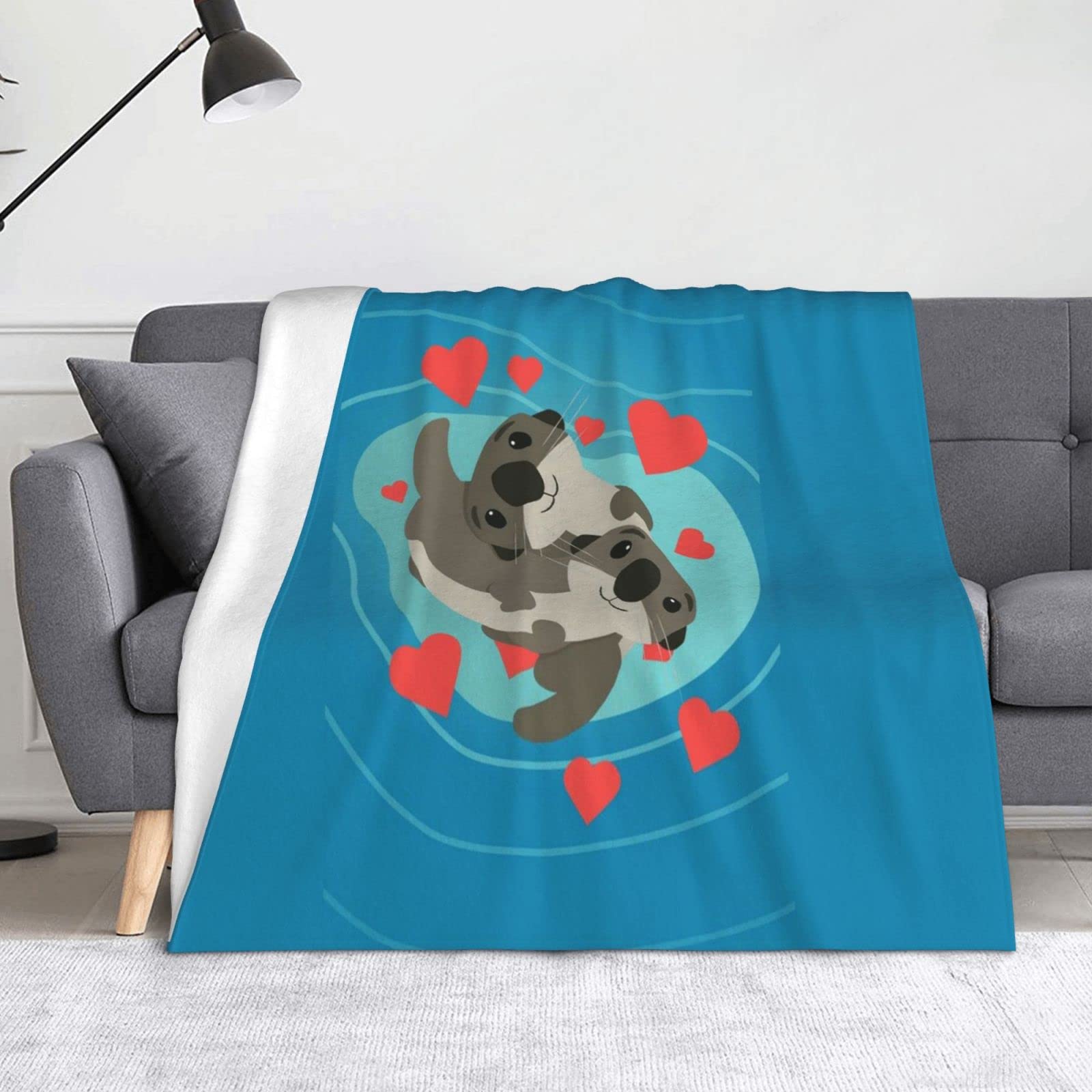 Plaid loutre en microfibre : couverture douce pour des instants de pur bonheur