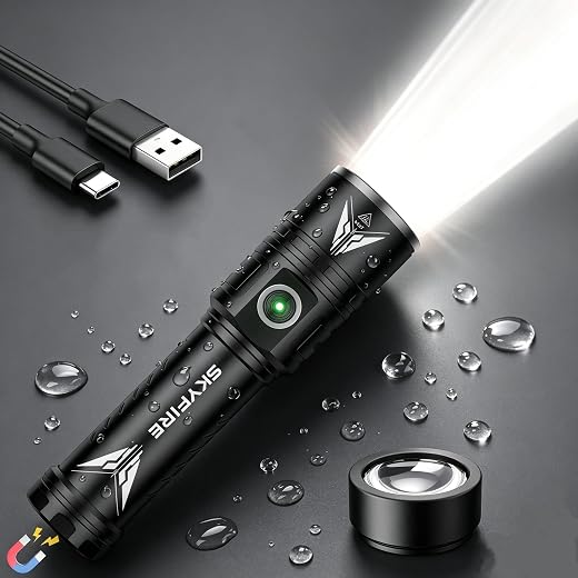 Black rechargeable flashlight with charging cables and water droplets