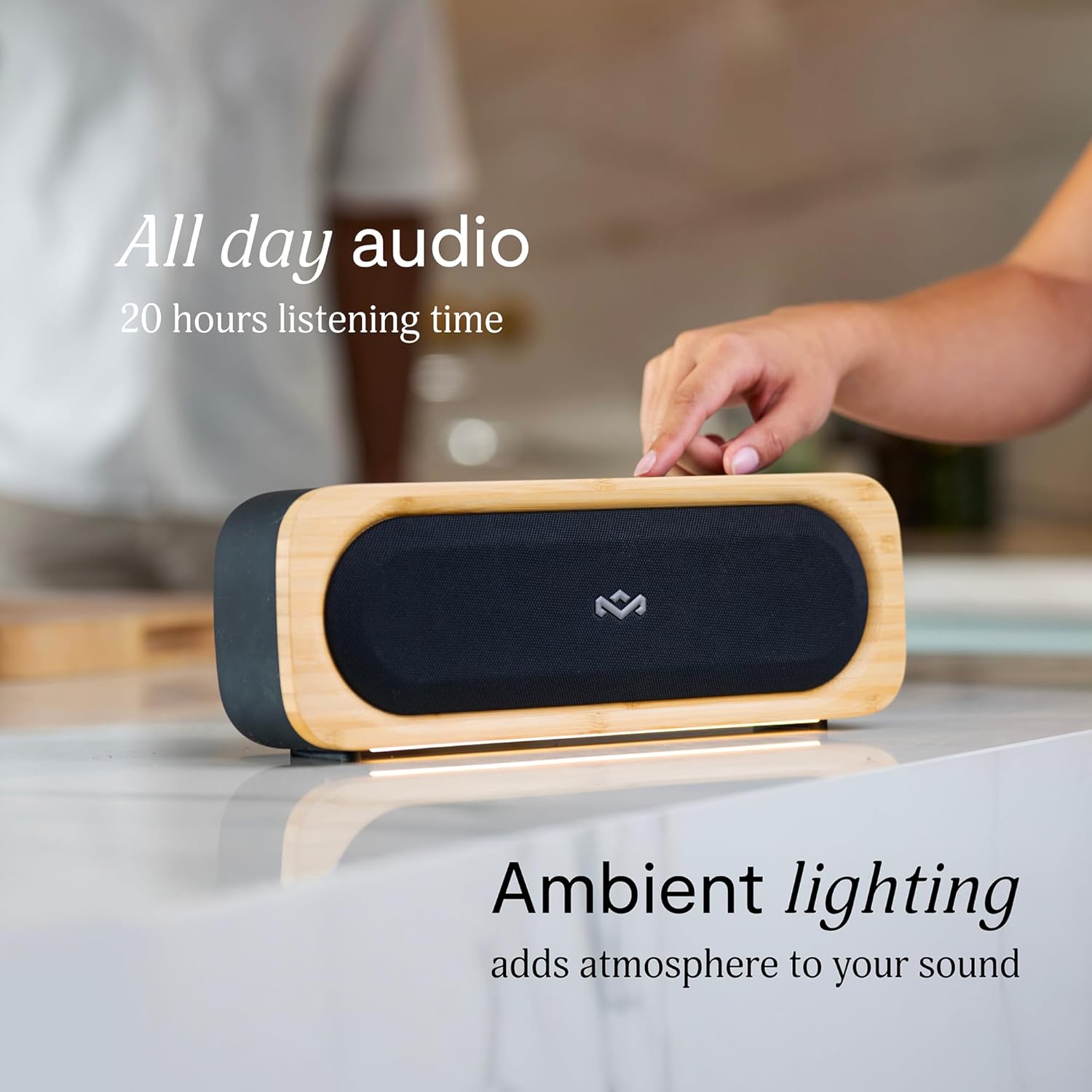 House of Marley Get Together Go speaker with its ambient lighting illuminated, creating a warm glow.