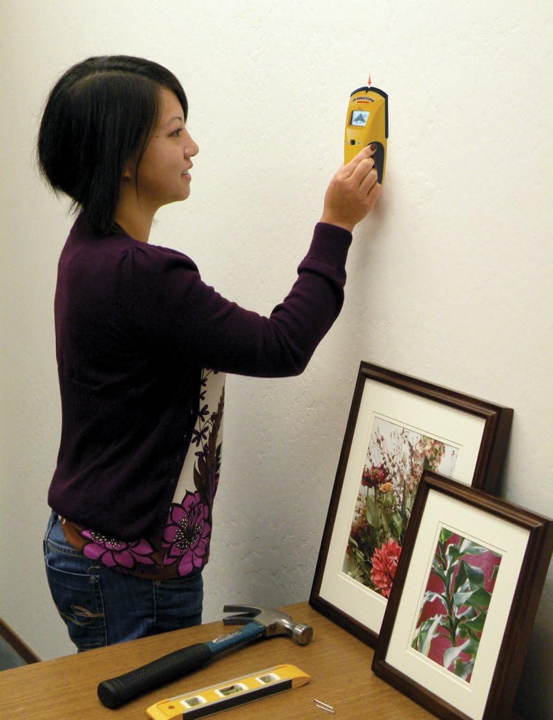 Person using Zircon StudSensor e50 on a wall