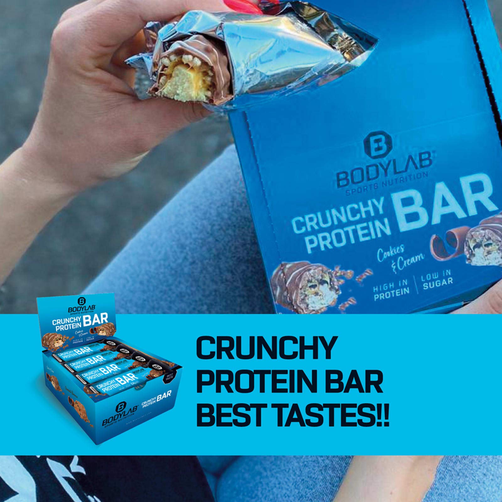 Bodylab24 Crunchy Protein Bar Cookies & Cream 12 x 64g Vorratsbox, knuspriger Protein-Riegel mit Schokoladenüberzug, mit 20g Eiweiß pro Riegel, High-Protein Low-Sugar, Eiweiß-Riegel mit wenig Zucker