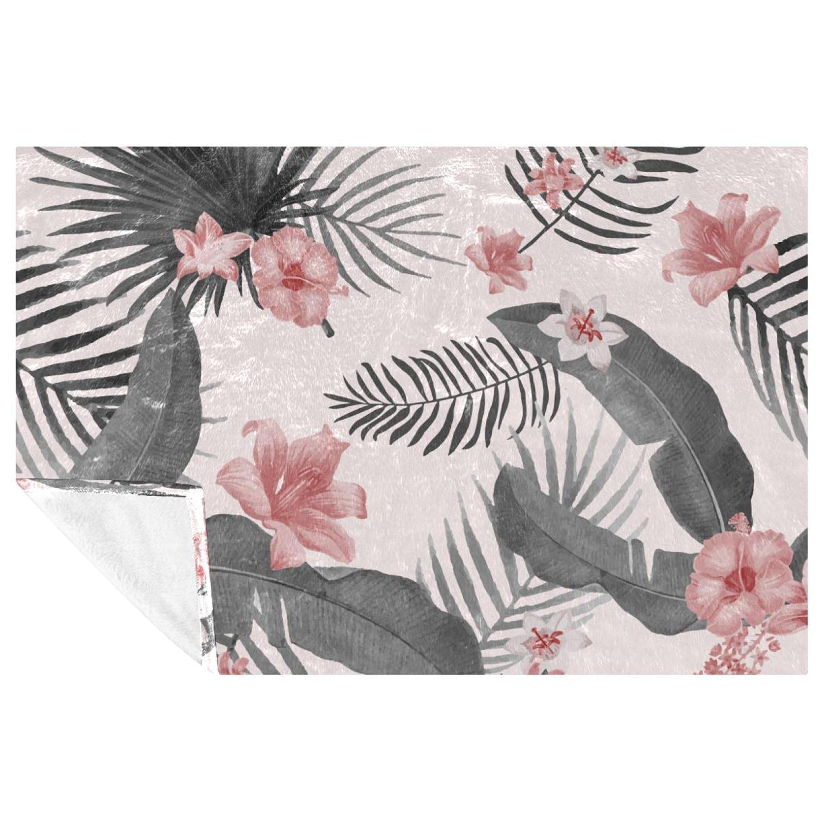 Couverture douce aux motifs de fleurs exotiques pour des instants cocooning
