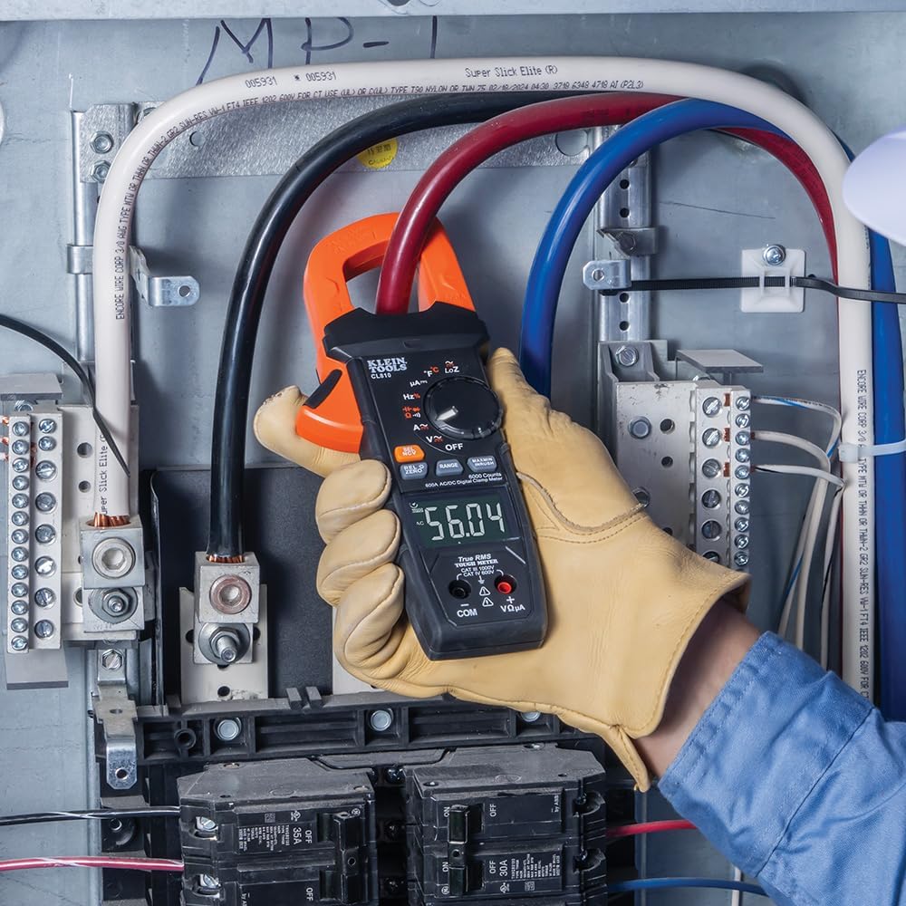 Electrician Uses Clamp Meter to Measure Current