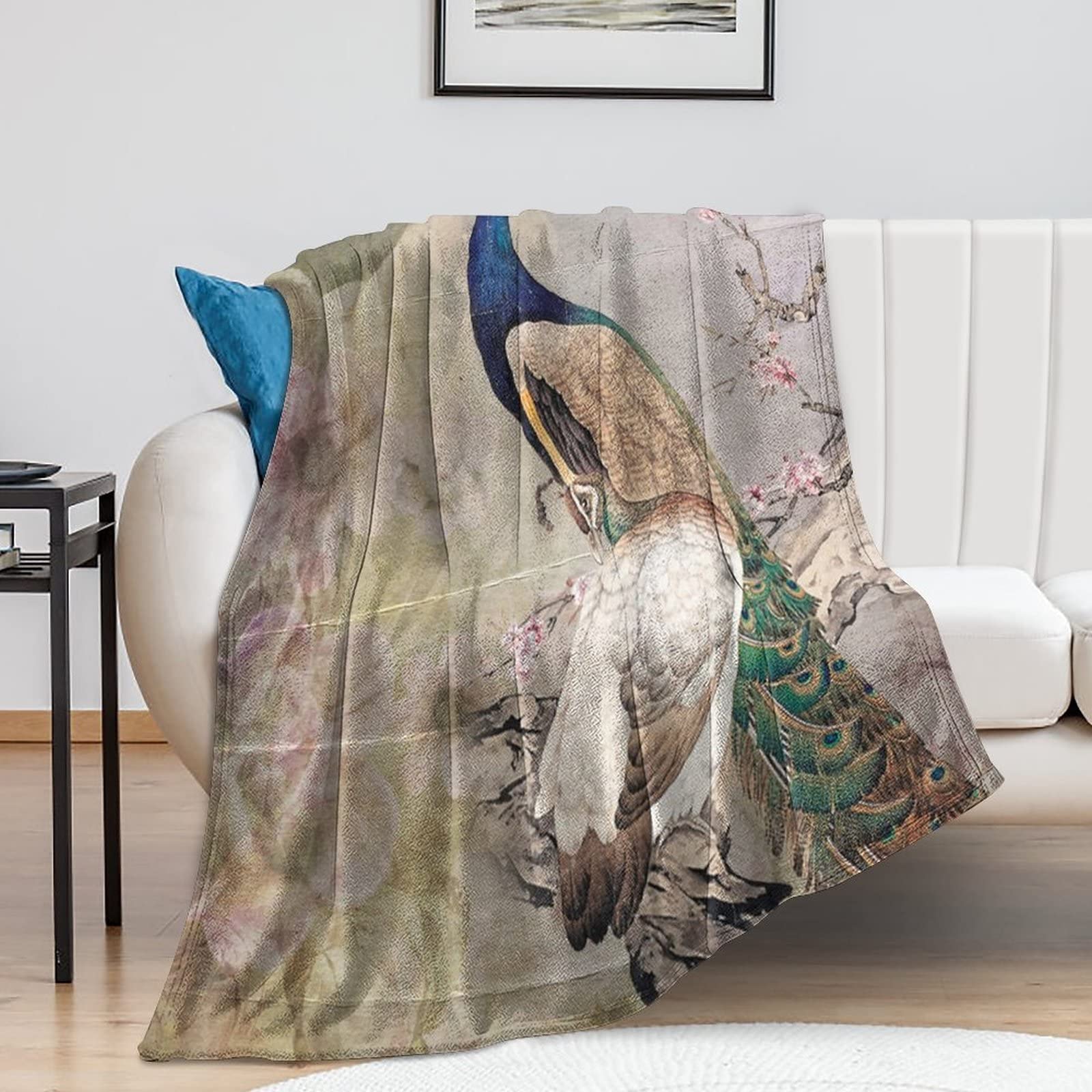 Couverture vintage paon pour vos soirées cocooning : le plaid polaire idéal au salon