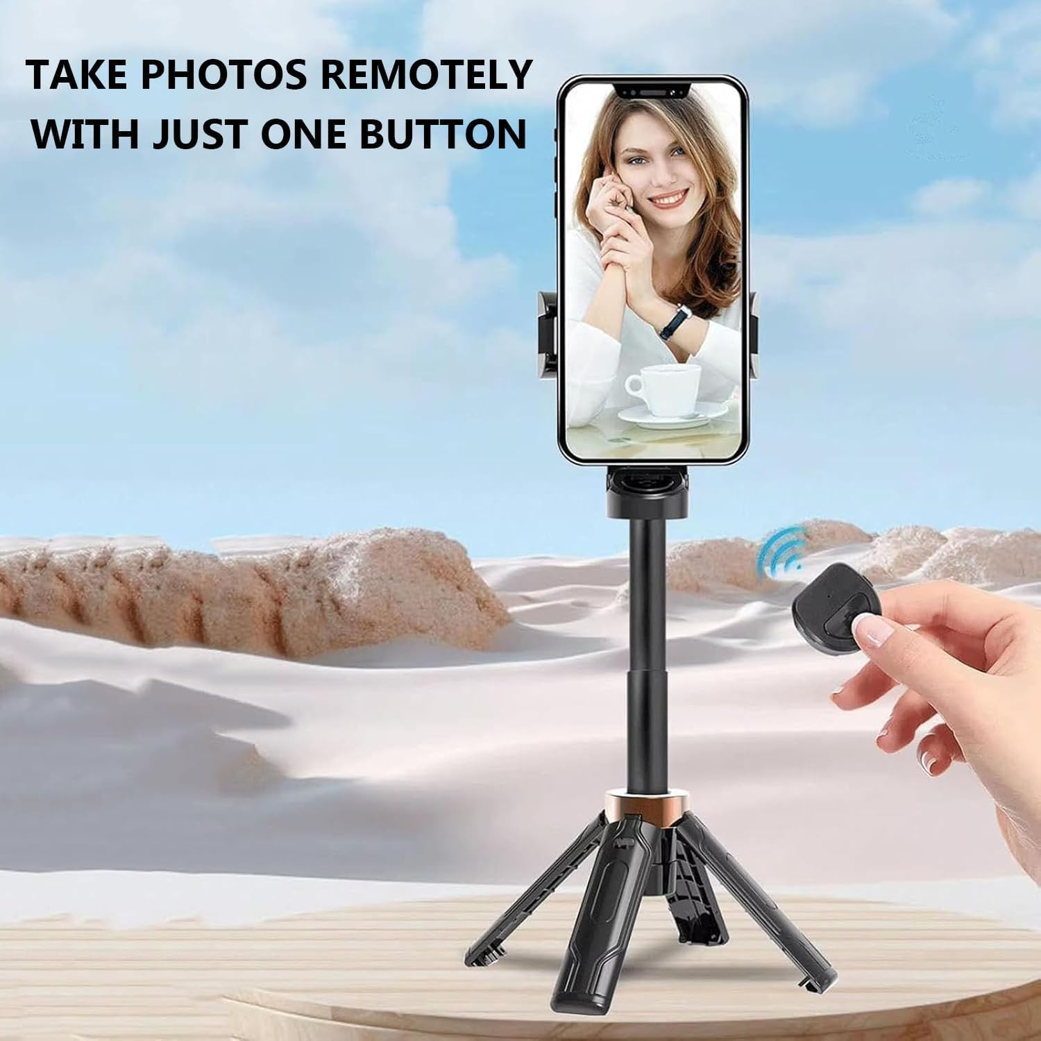 Person holding the Techlypro P15 Mini Tripod 360 extended as a selfie stick, using the remote control to take a photo.