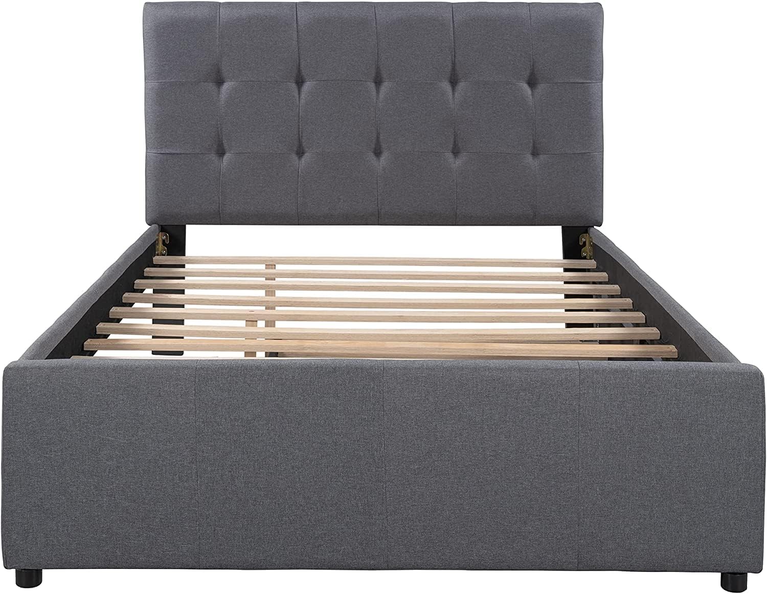 Installing wooden slats onto the main bed frame.