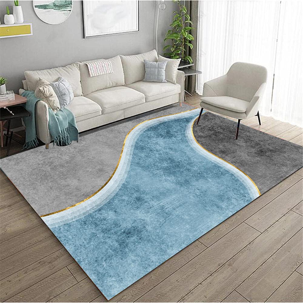 Tapis graphique abstrait gris et bords dorés style haut de gamme