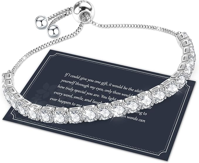 silver and crystal tennis bracelet laying on a message card