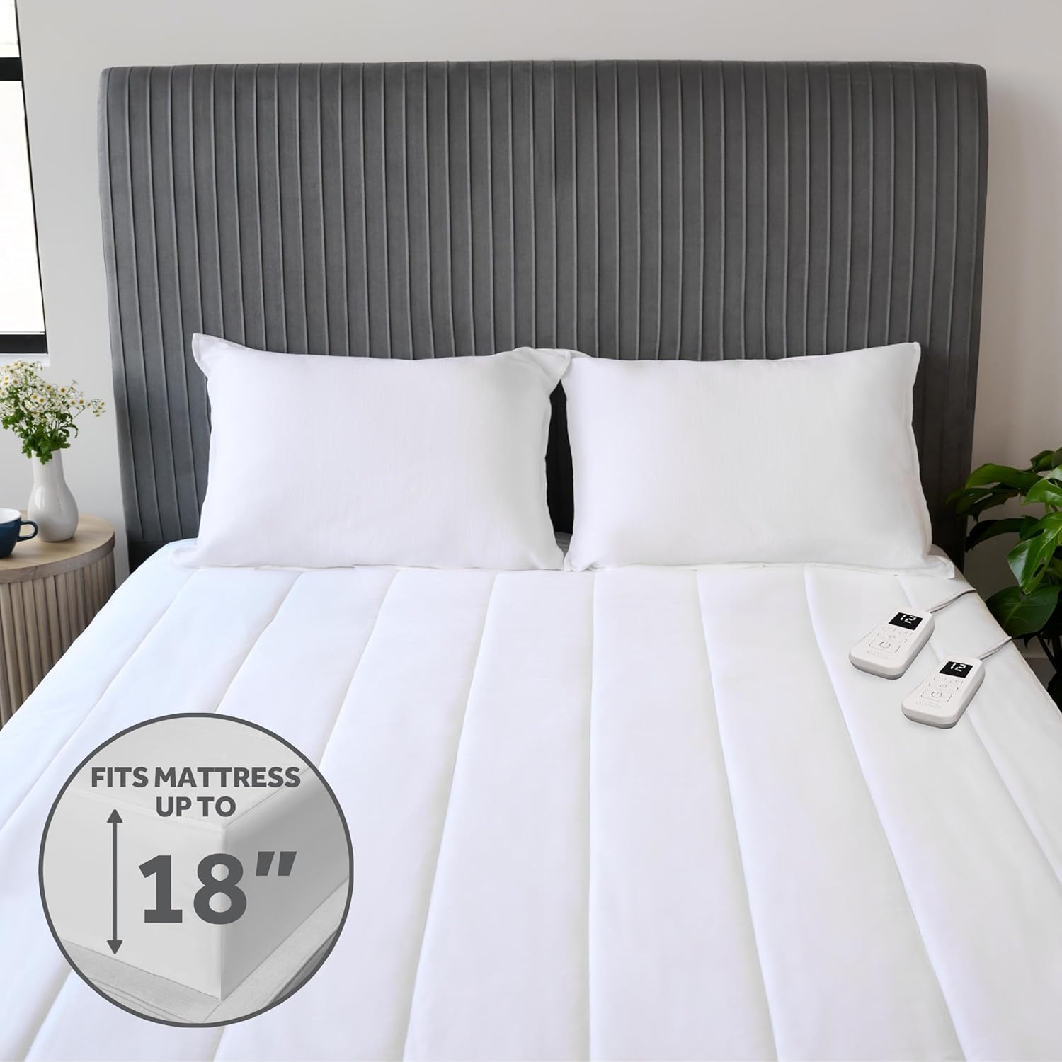 The heated mattress pad fitted on a mattress, showing it accommodates mattresses up to 18 inches deep.