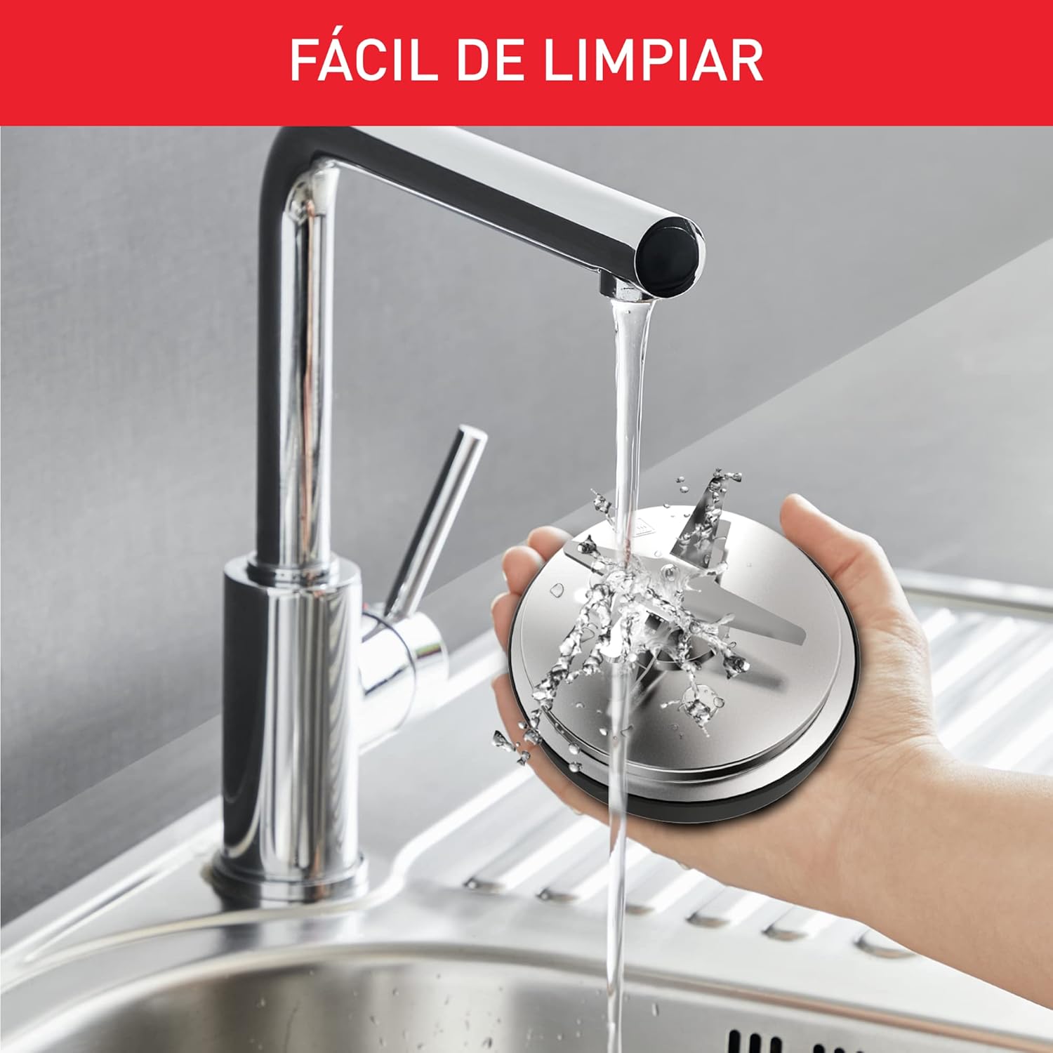 Hand rinsing the detachable blade assembly of the Moulinex Perfect Mix+ LM835D under running water
