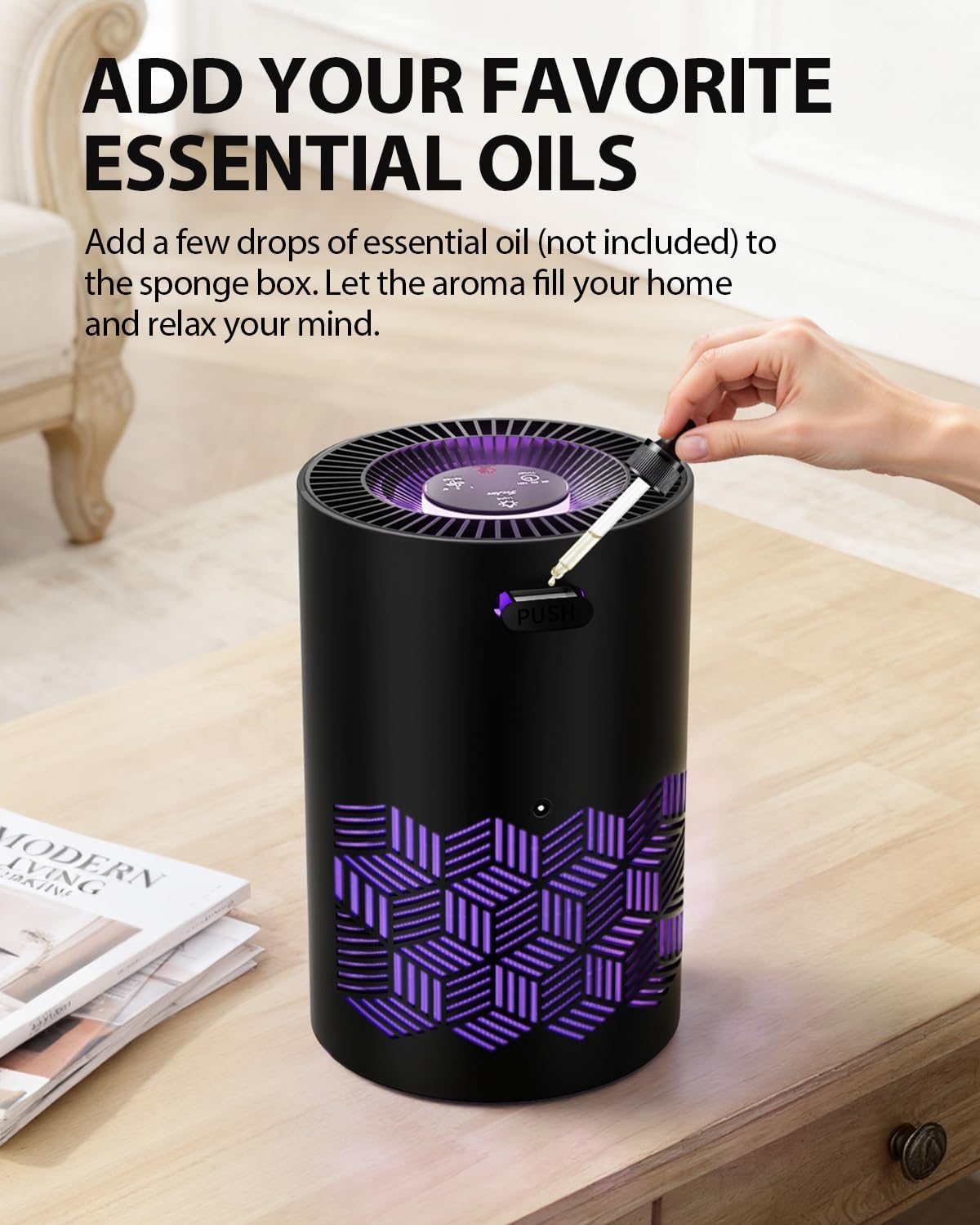 A hand adding essential oil drops to a sponge box on top of an air purifier.