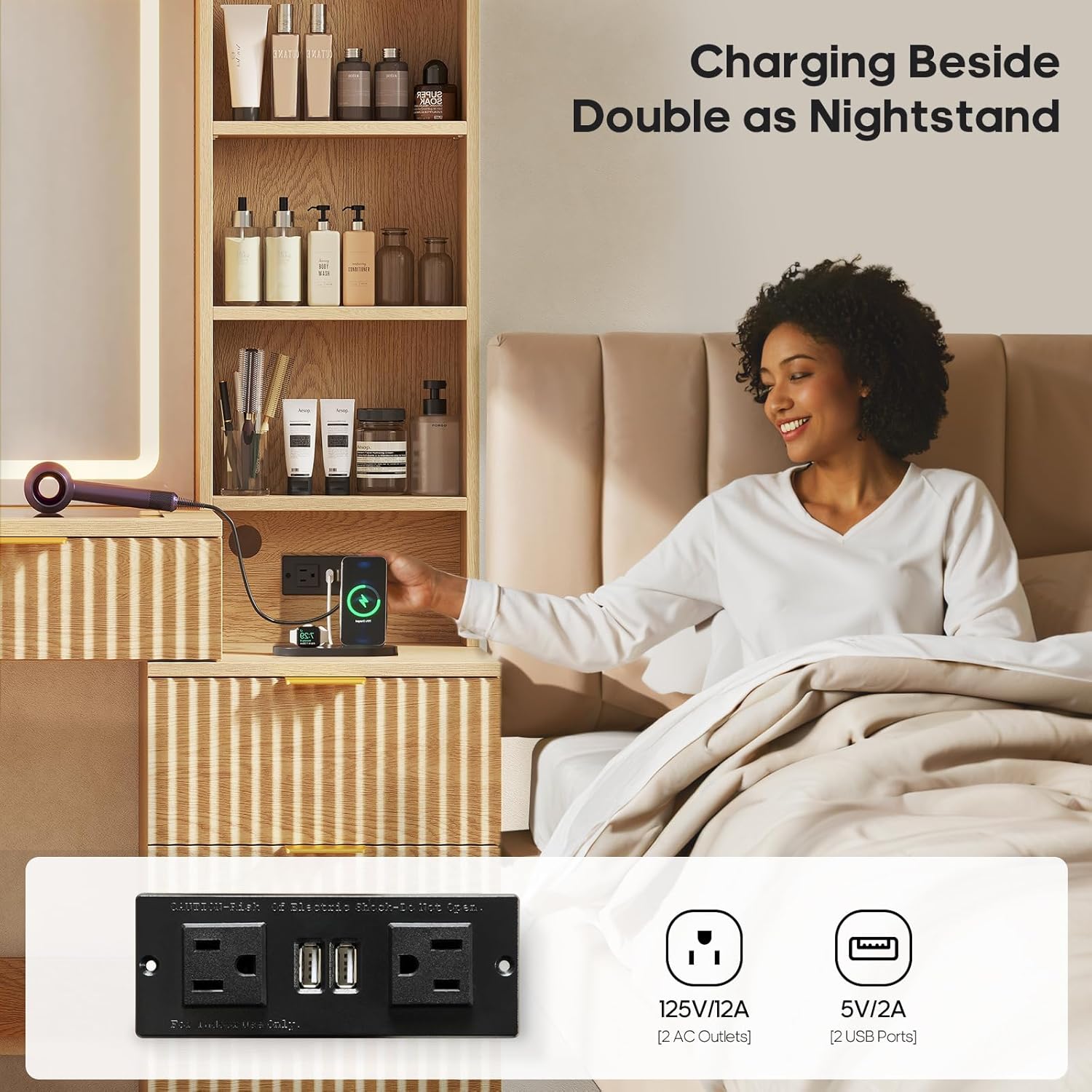 HAUOMS VT05 Vanity Desk showing the built-in power outlet with AC and USB ports, charging a phone.