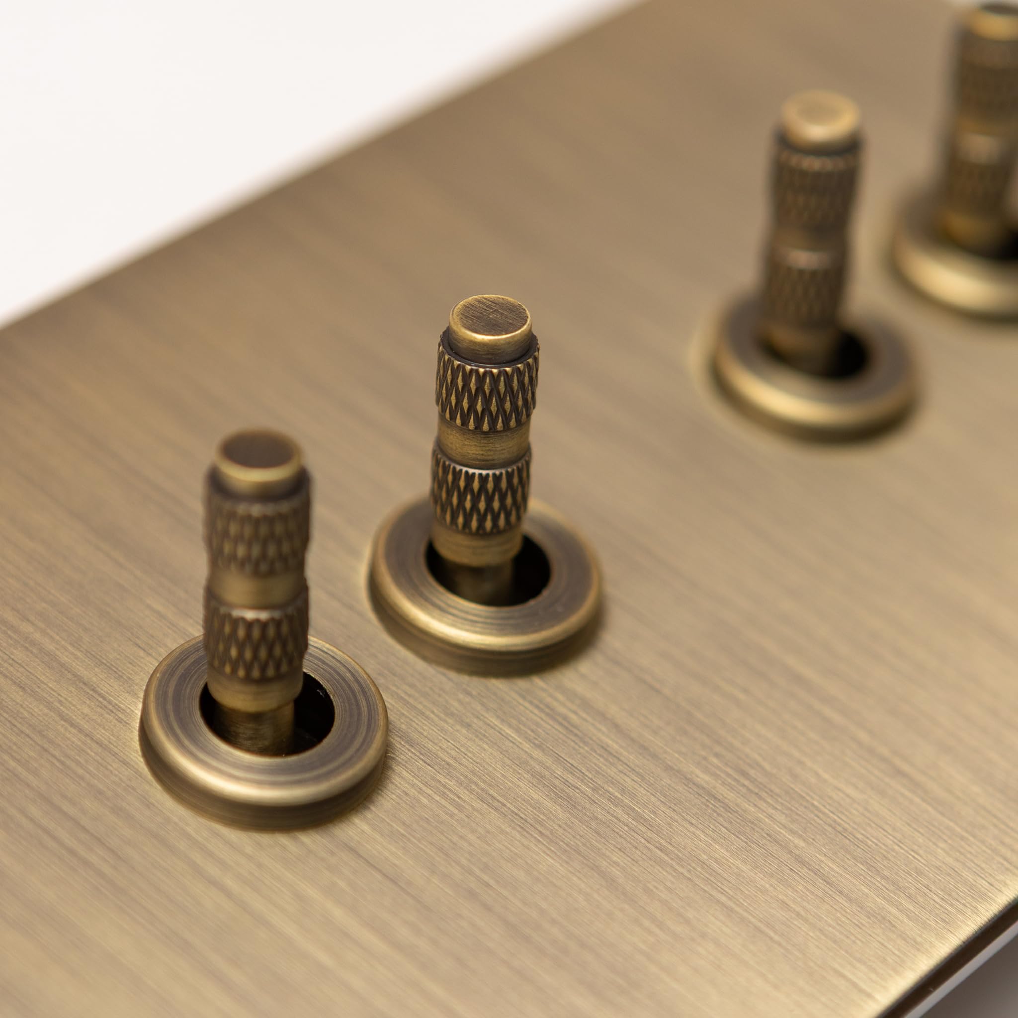 Foundry Series Knurled Toggle Switches and Sockets – Antique Brass (4 Gang 2 Way Toggle 146X88) — image 1