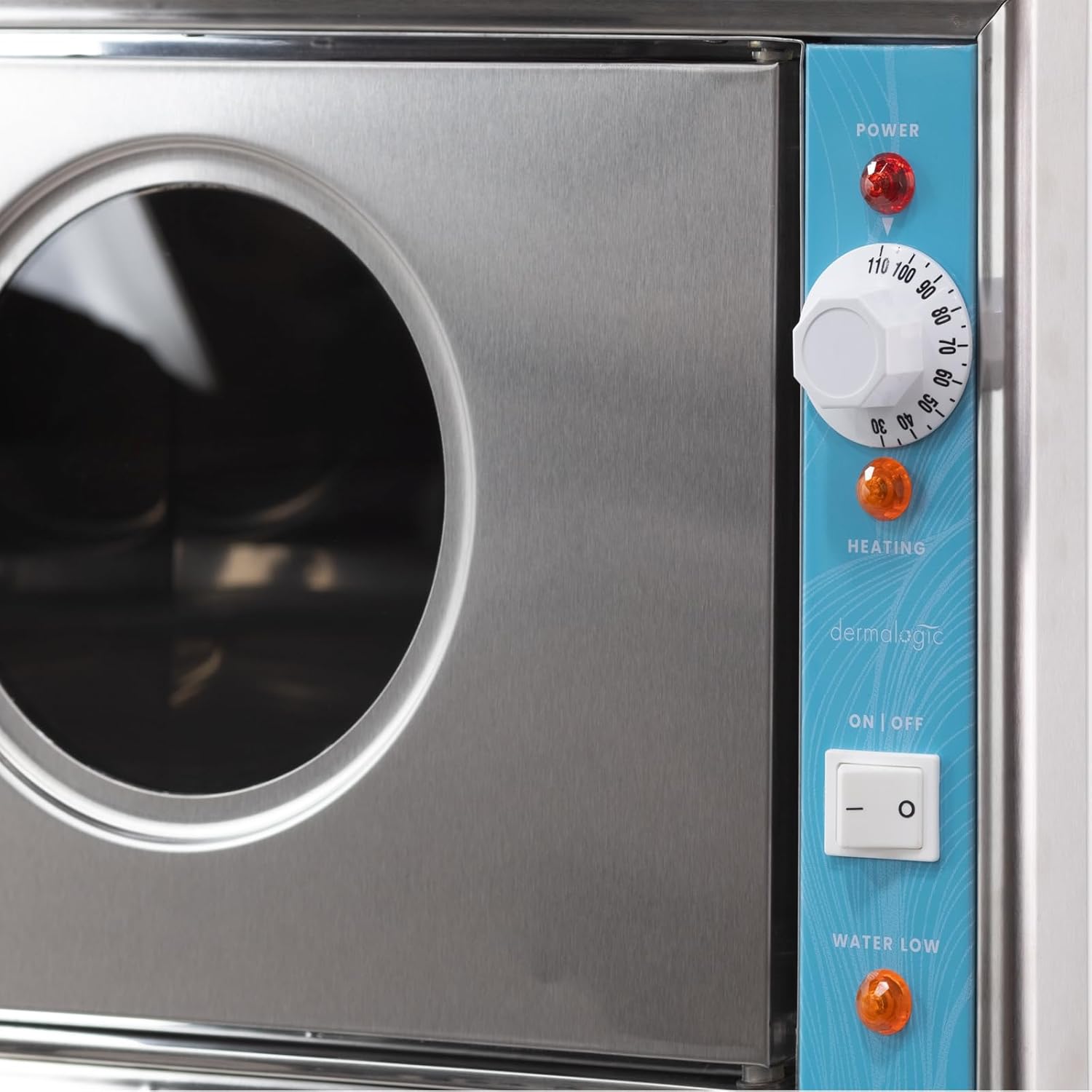 Close-up of the control panel on the DERMALOGIC Towel Steamer 36, showing the power light, temperature dial, heating light, on/off switch, and water low light.