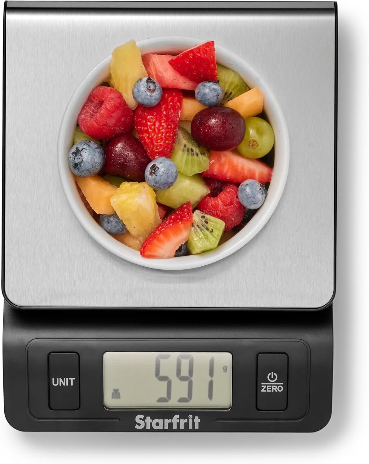 Starfrit Digital Kitchen Scale with a bowl of fruit salad on its stainless steel platform, displaying '591 g'.