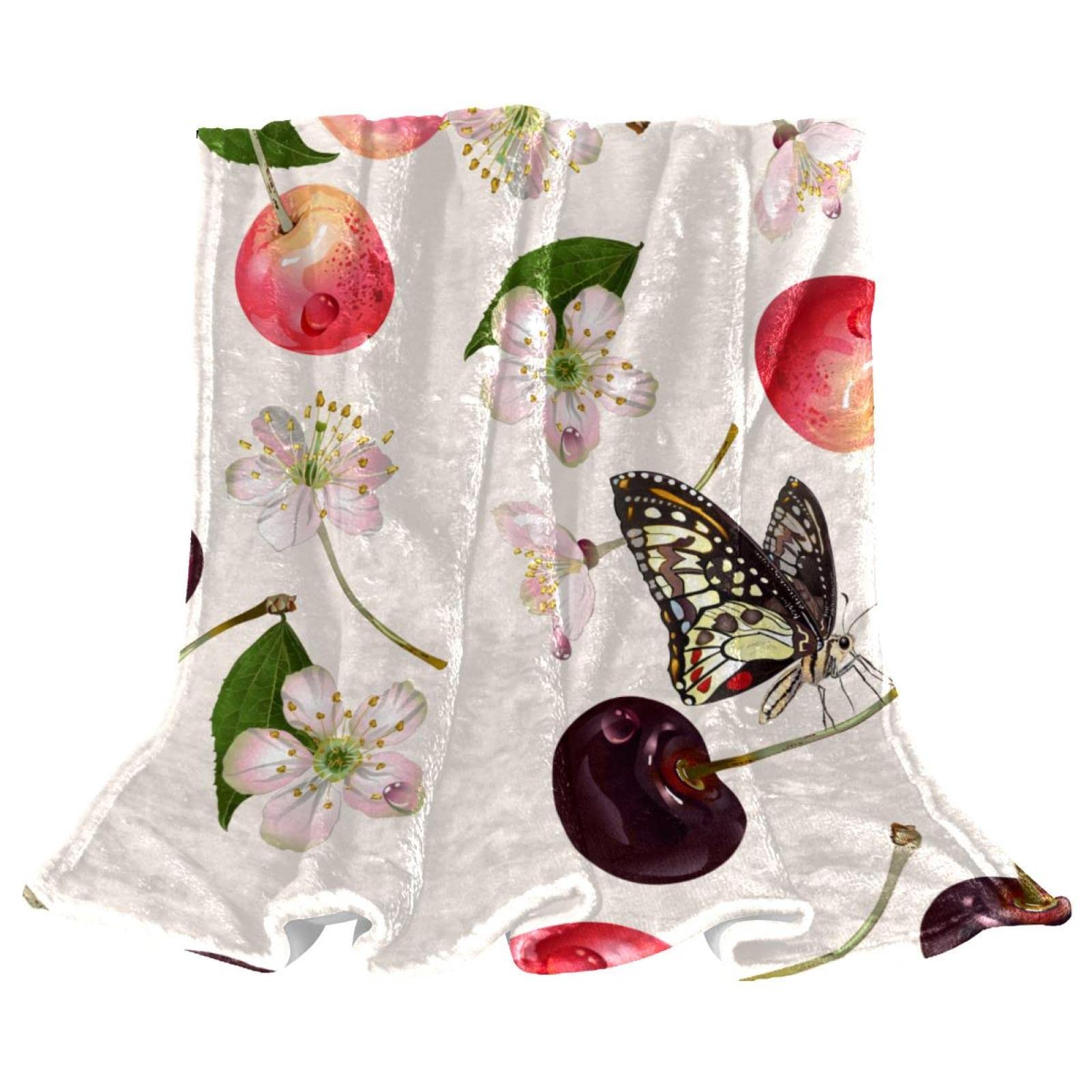 Couverture polaire lit imprimé cerises pour une ambiance de chambre cosy