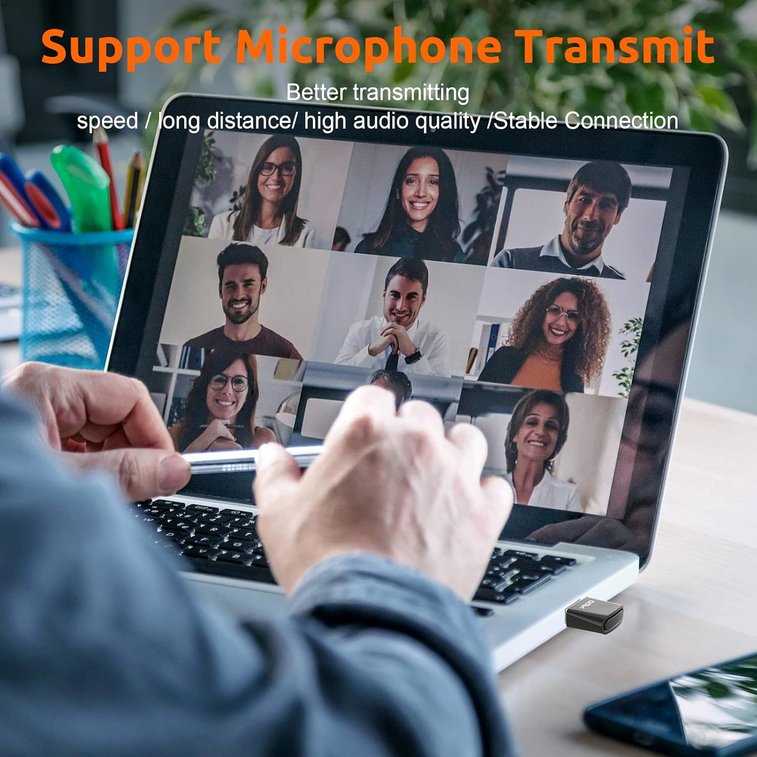 Person participating in a video call using the YMOO B10Q adapter for microphone transmission