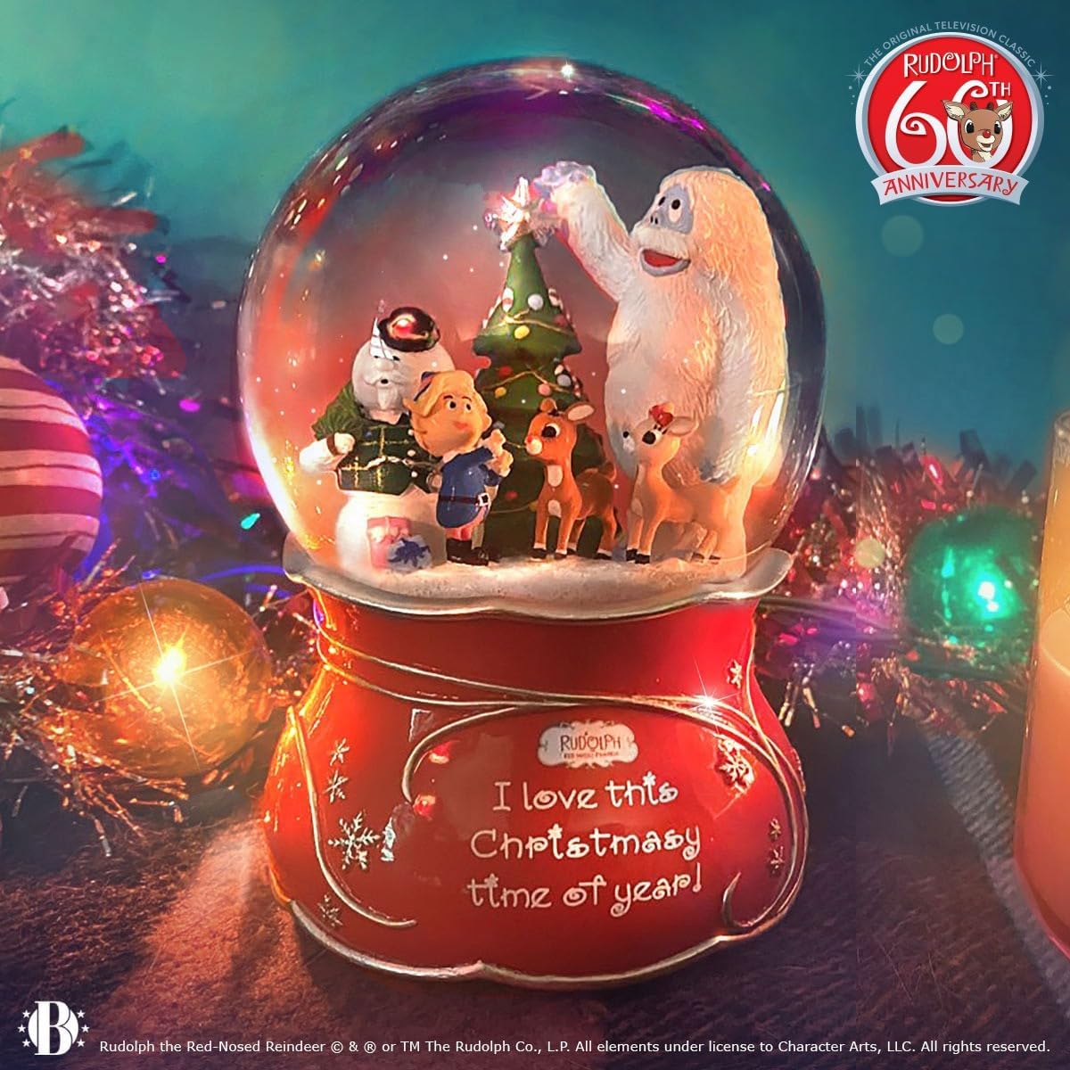 Rudolph The Red-Nosed Reindeer Musical Glitter Globe Featuring A Joyful Sentiment & Silvery Bas-Relief Accents On The Base