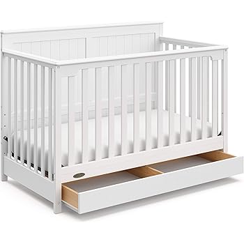 white crib with wood legs