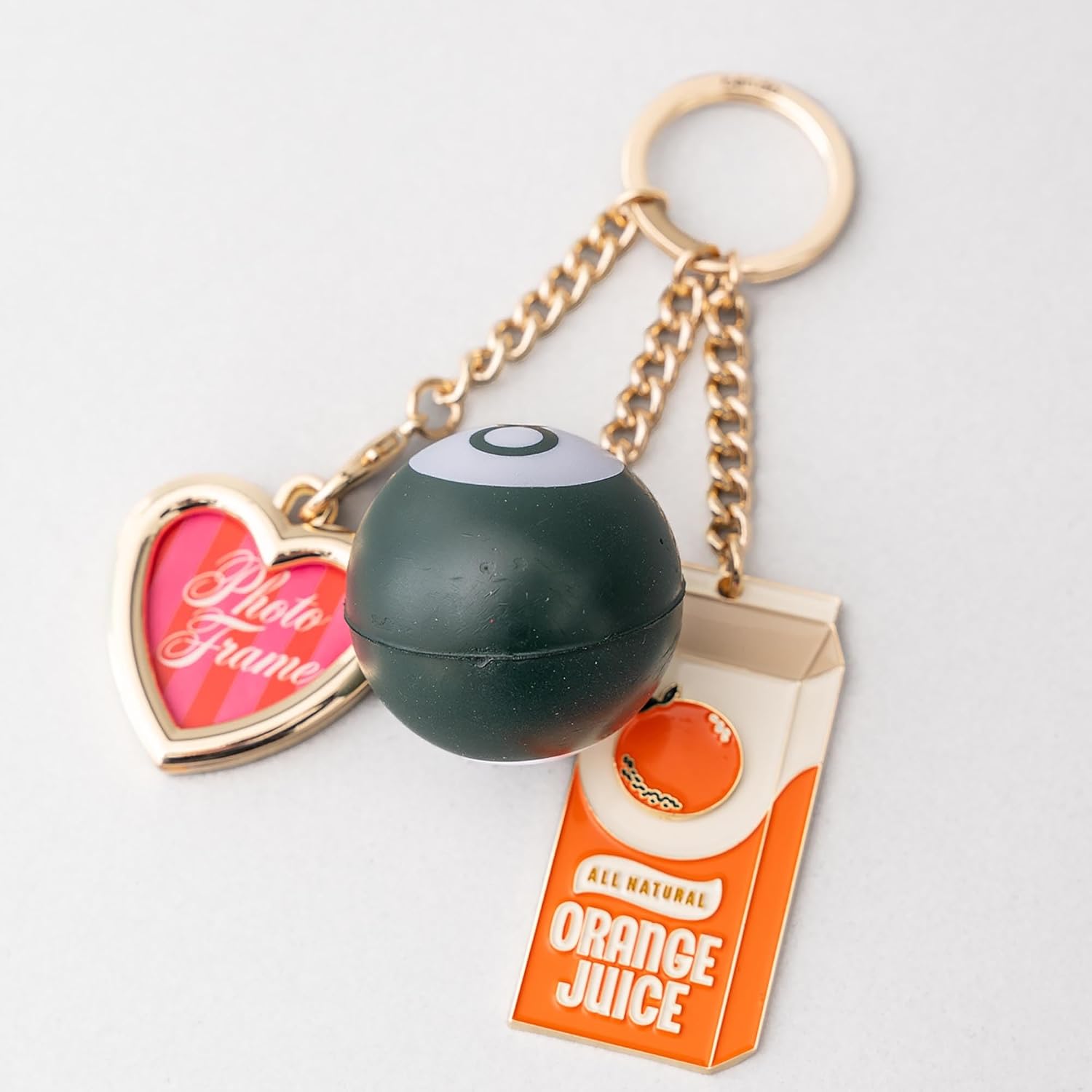 ban.do Trinket Keychain with Charms, Cute Gold Keychain with Charm, De-Stress Ball, and Frame, Orange Juice