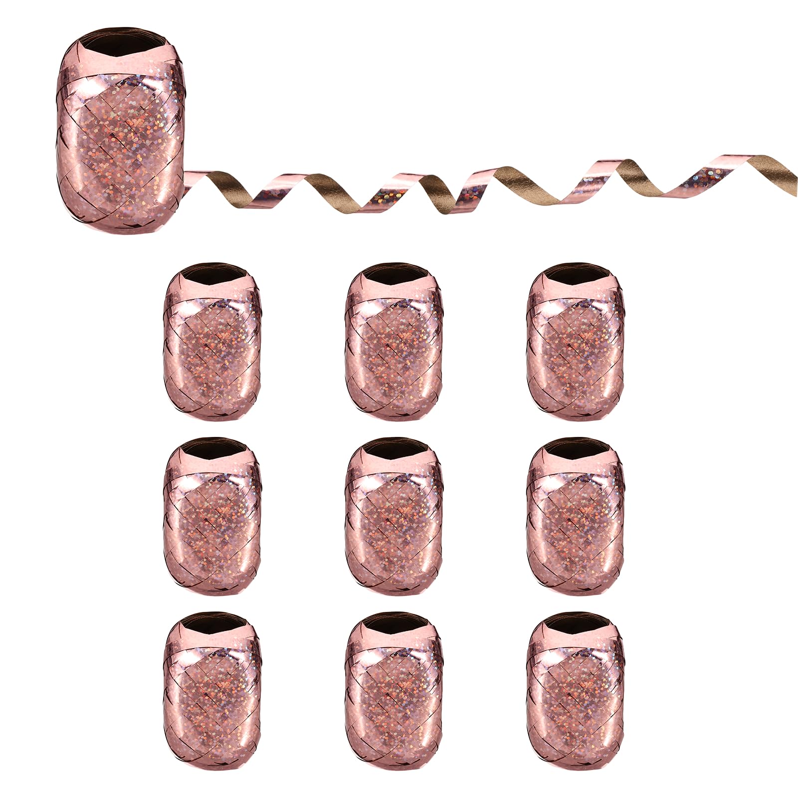 Ruban à friser or rose contre les emballages ternes de mariage et anniversaire