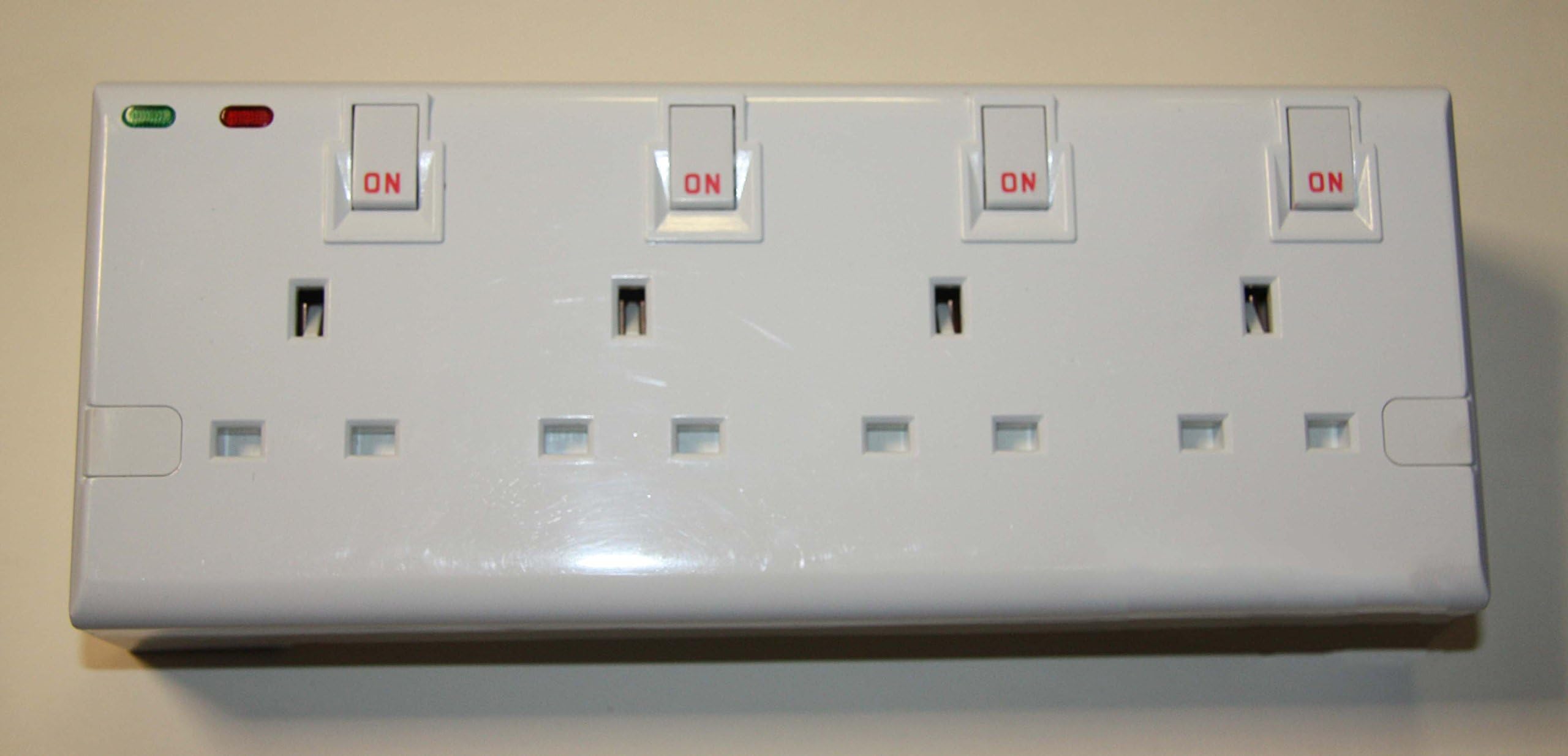 2To4 4 Gang double socket surge protected plug in adaptor. (all switched)