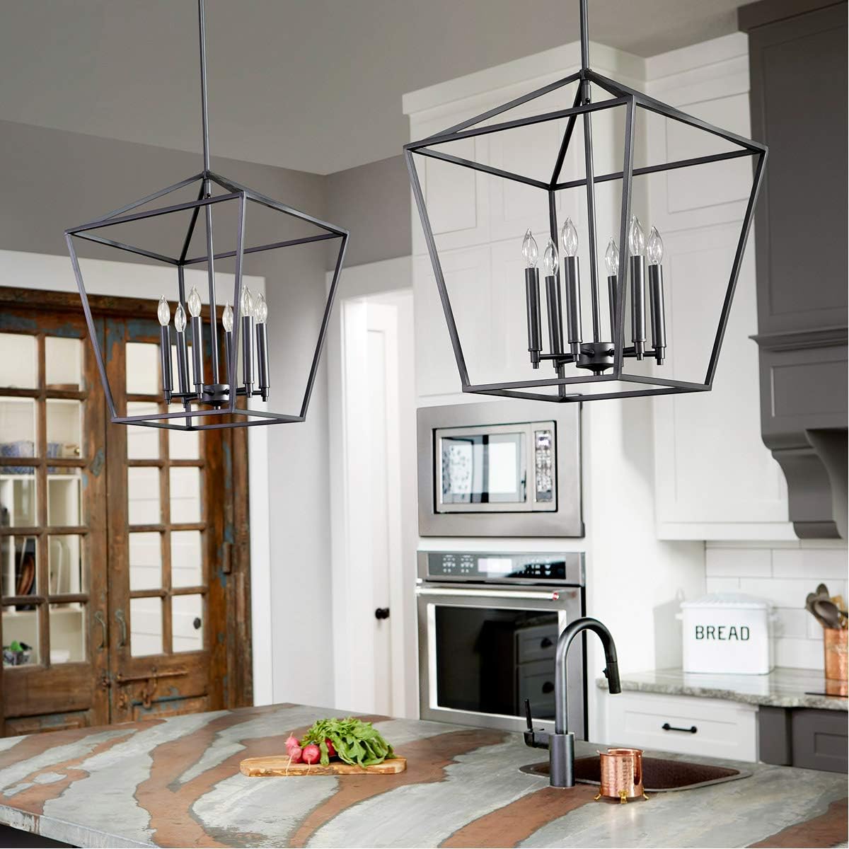 Two Quorum International Gabriel 6-Light Entry Pendants installed above a kitchen island.