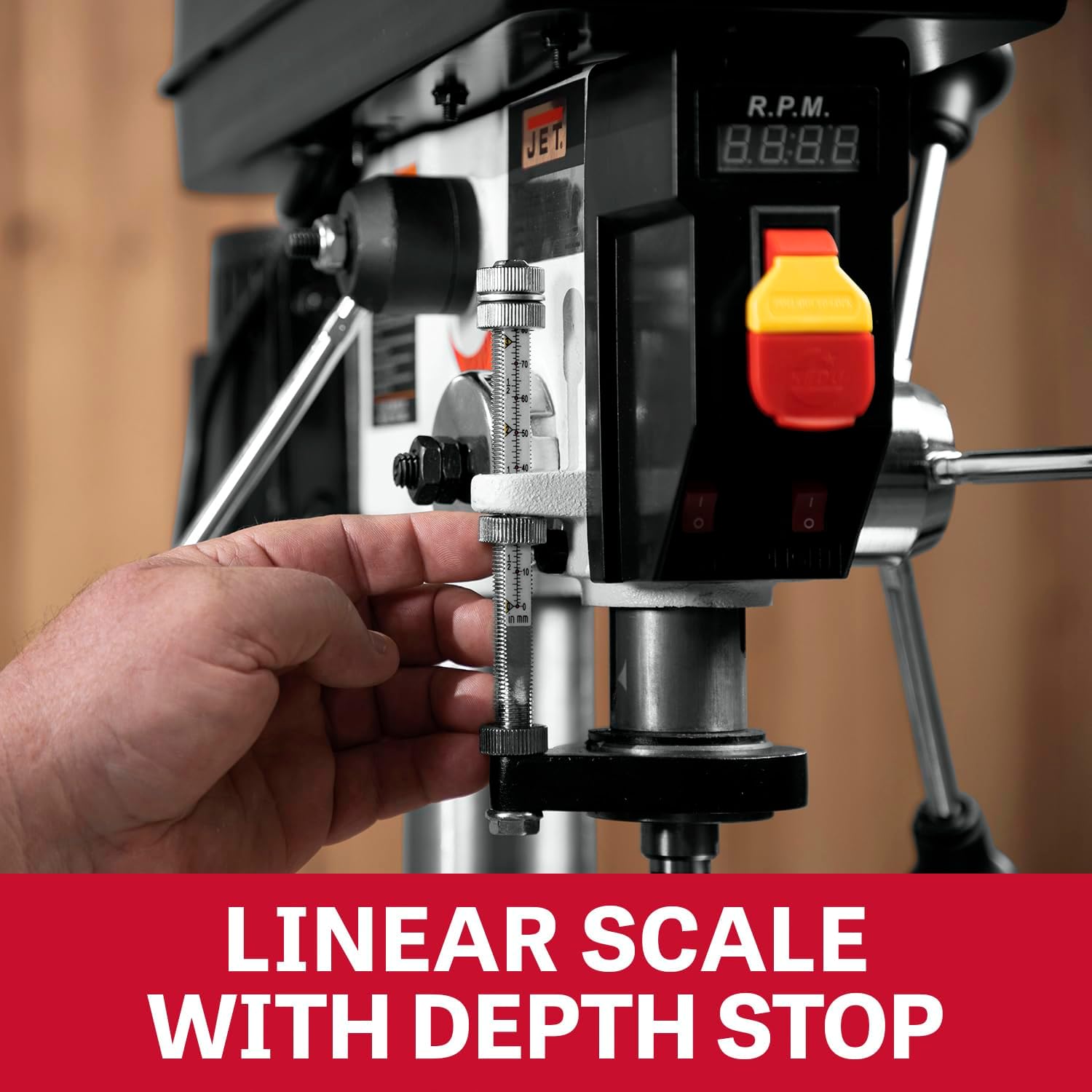 Close-up of the linear depth scale and depth stop mechanism on the drill press