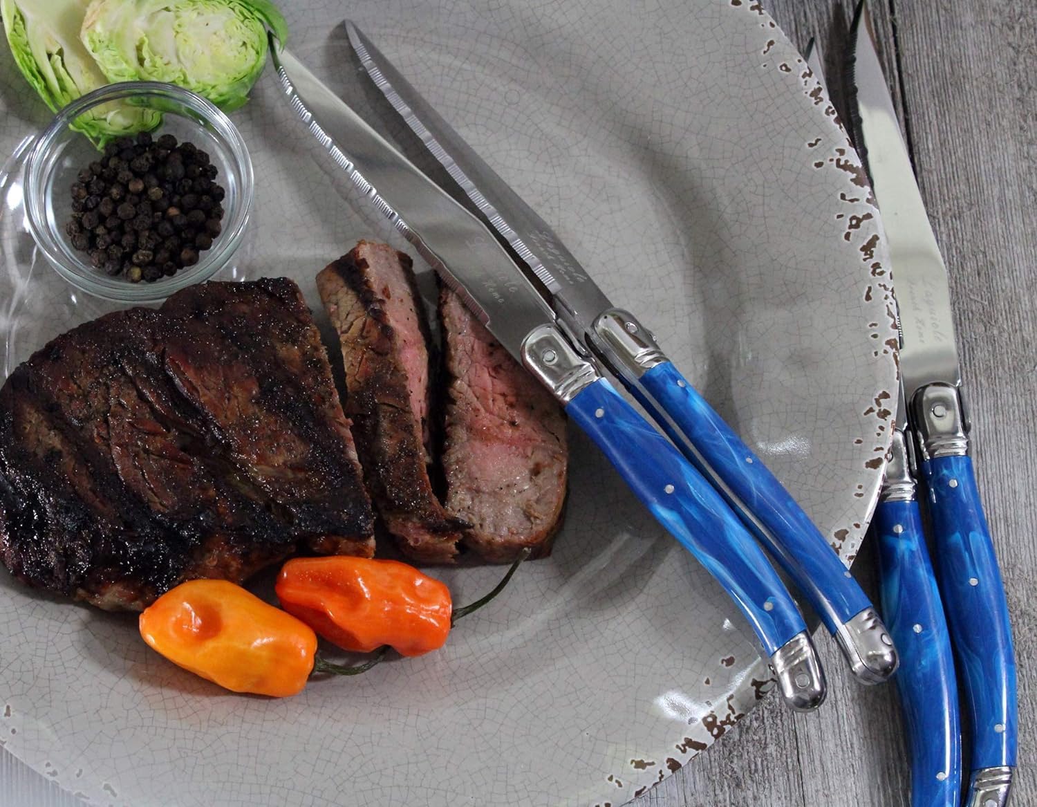 French Home Laguiole 4-Piece Steak Knife Set – Sophisticated Stainless Steel Dinner Knives with Blue Marble Handles & Iconic Bee Emblem – Serrated Knives for Smooth Cutting (9.25")