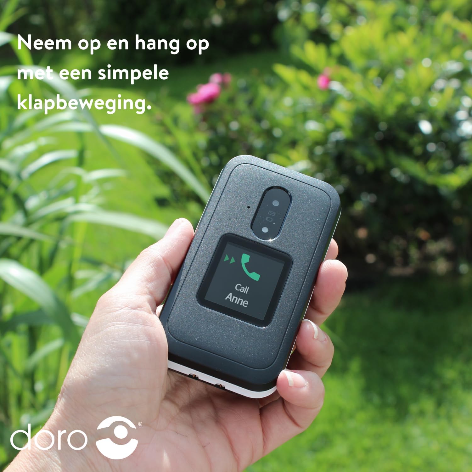 Hand holding DORO Leva E30, demonstrating flip to answer