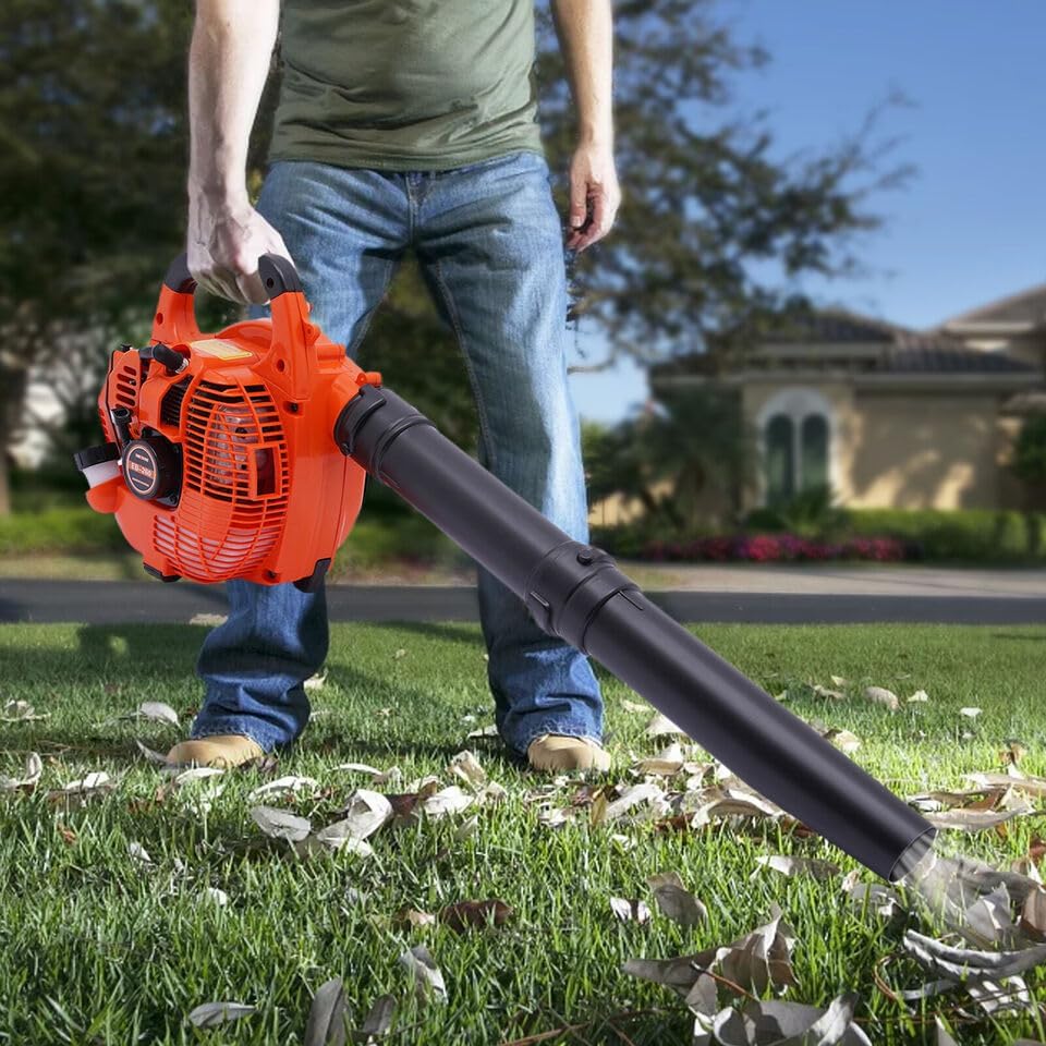 A person operating the Gosangom 25.4CC Petrol Leaf Blower in a yard, blowing leaves.