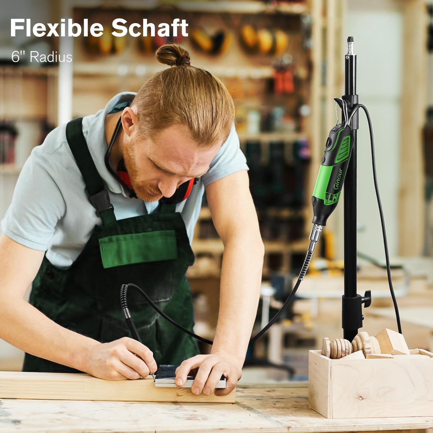 A person using the Ginour rotary tool with the flexible shaft attachment for detailed work on wood