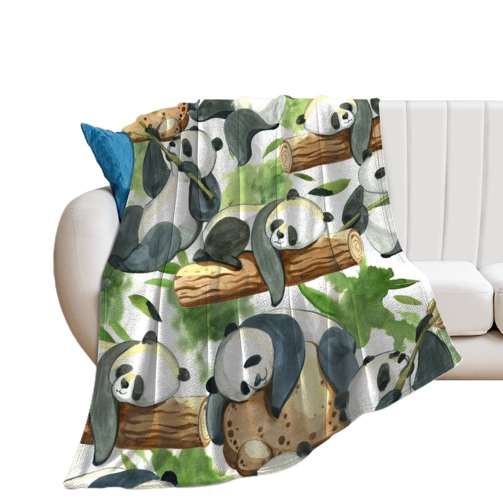 Couverture panda noir et blanc pour cocooning sur le canapé du salon