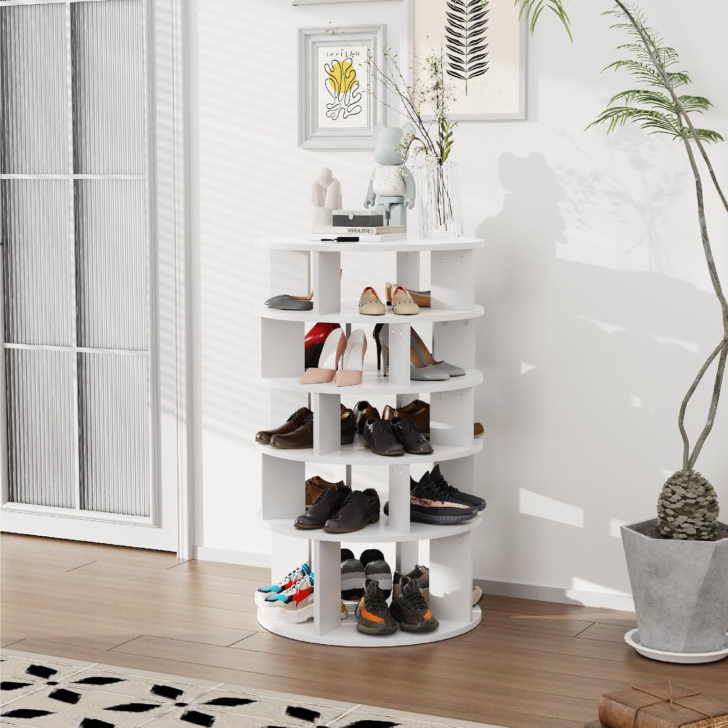 Redlife Rotating Shoe Rack filled with various types of shoes, including sneakers, heels, and boots, in a room setting.