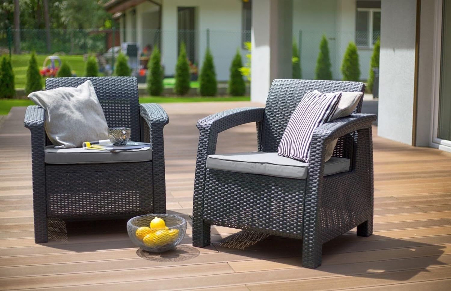 Two Allibert by Keter Corfu armchairs on a wooden patio