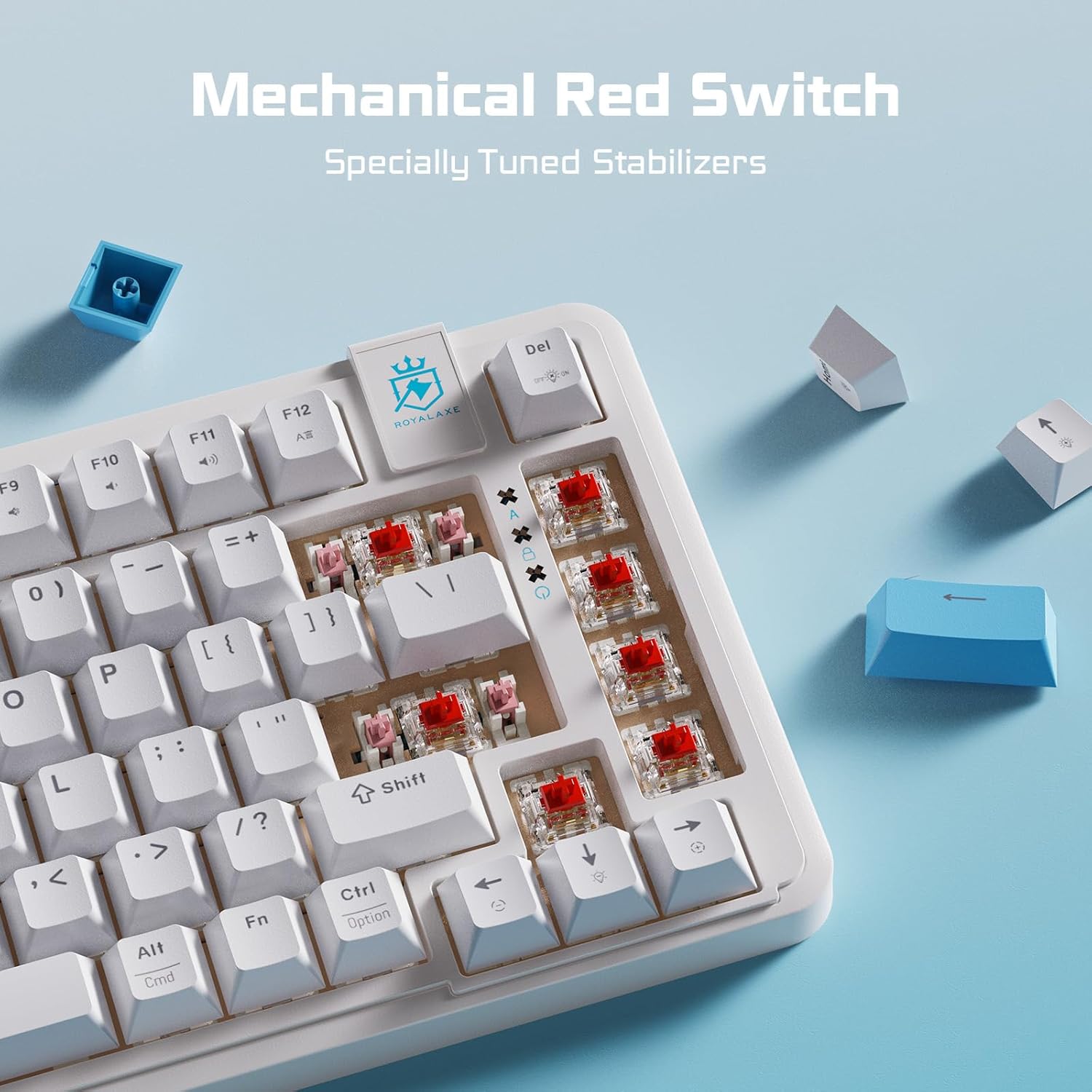 Close-up of mechanical red switches on the keyboard with a keycap puller demonstrating removal