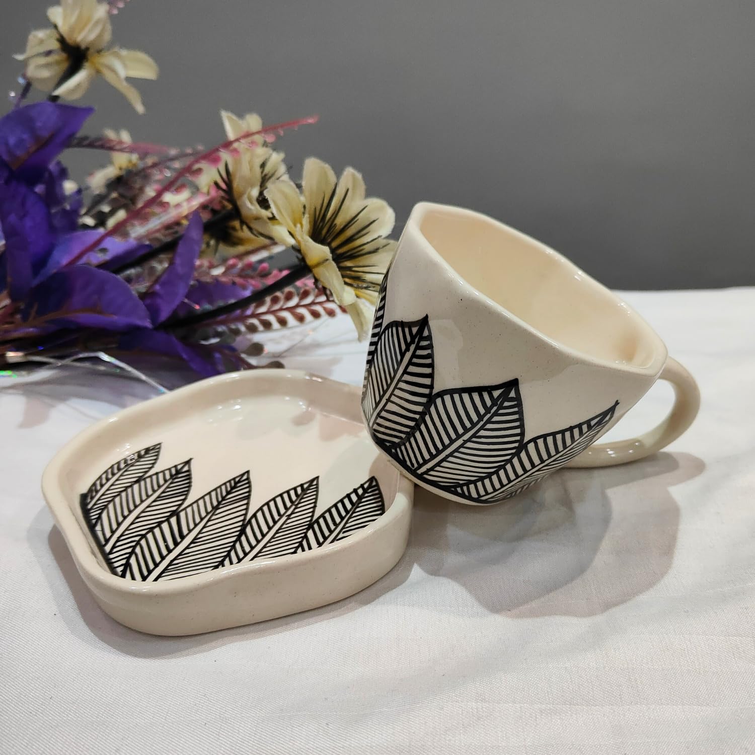 DIVYAKALAA Handpainted Ceramic Tea Cup & Saucer Set || 300 mL, Microwave Safe || Ceramic Coffee Mug - Tea Cup Gift and Special Occasions (Black Leaves)