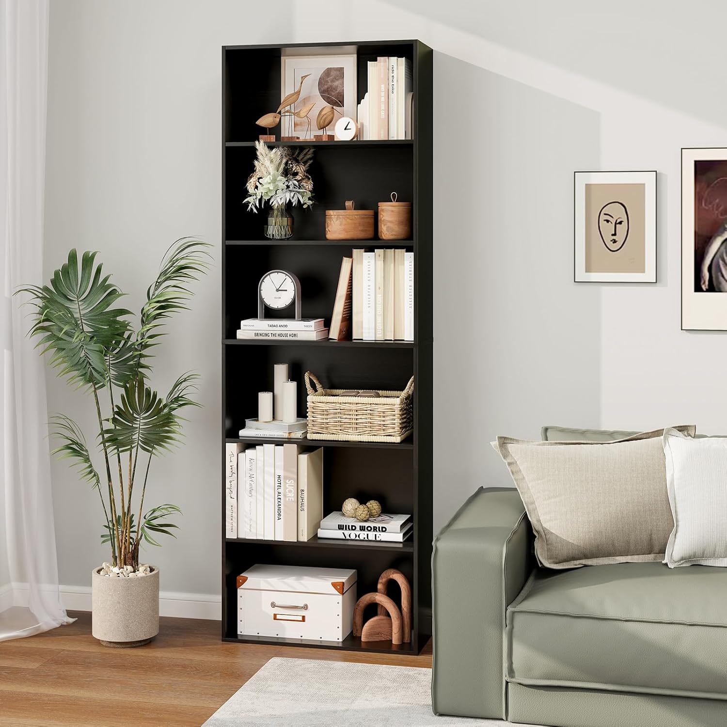A black 6-tier bookcase filled with books, plants, and decorative items in a living room setting.